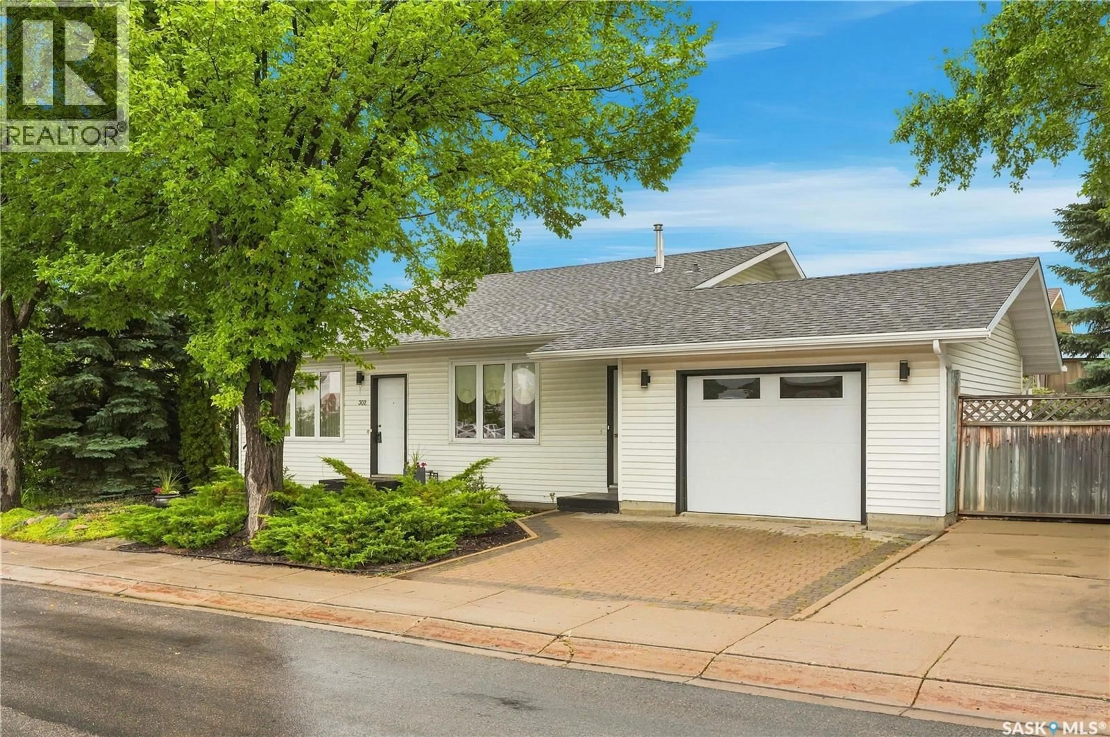 Home with vinyl exterior material, street for 302 NEMEIBEN ROAD, Saskatoon Saskatchewan S7J4S7