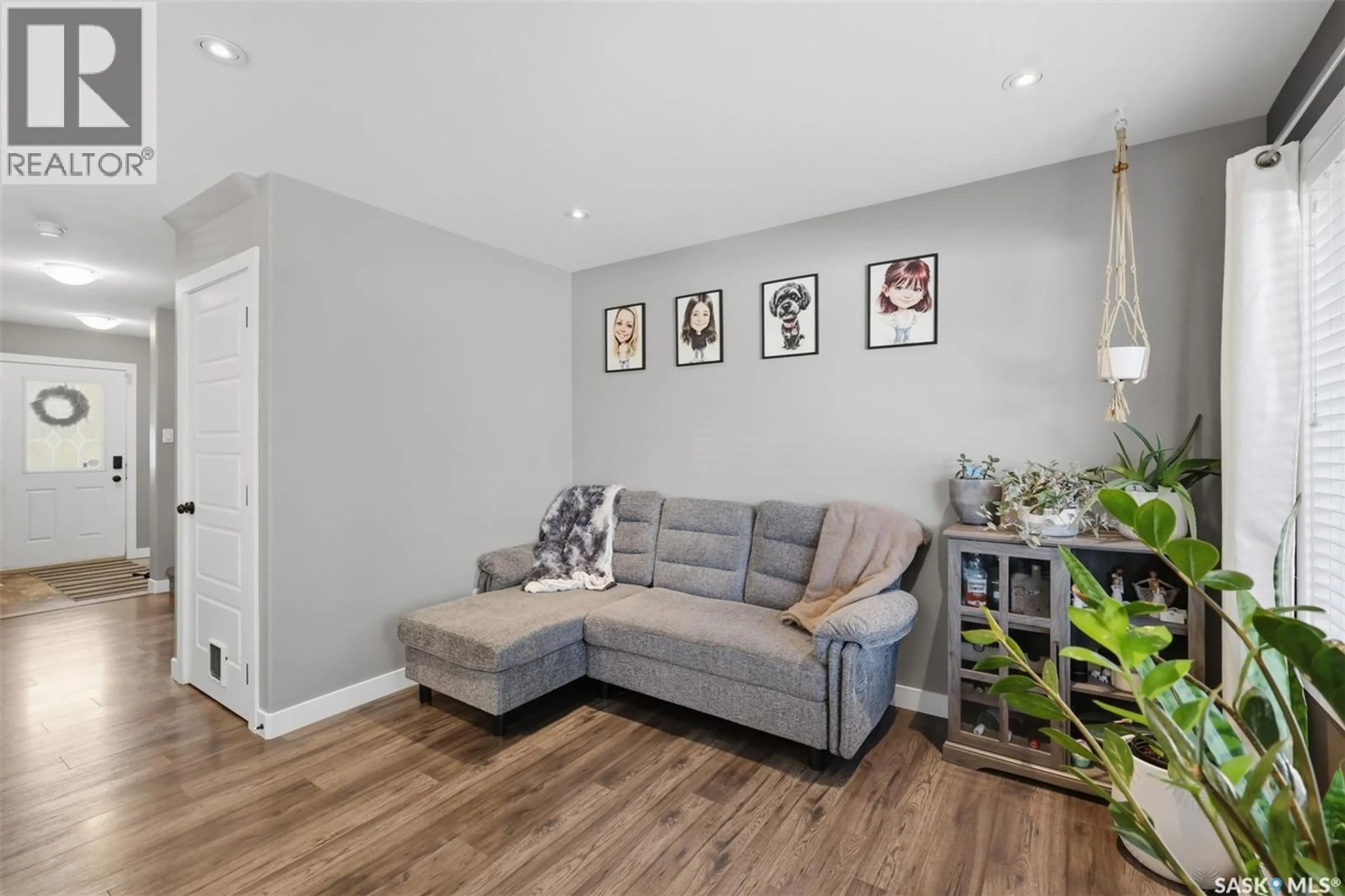 Living room with furniture, wood/laminate floor for 183 BEAUDRY CRESCENT, Martensville Saskatchewan S0K2T1