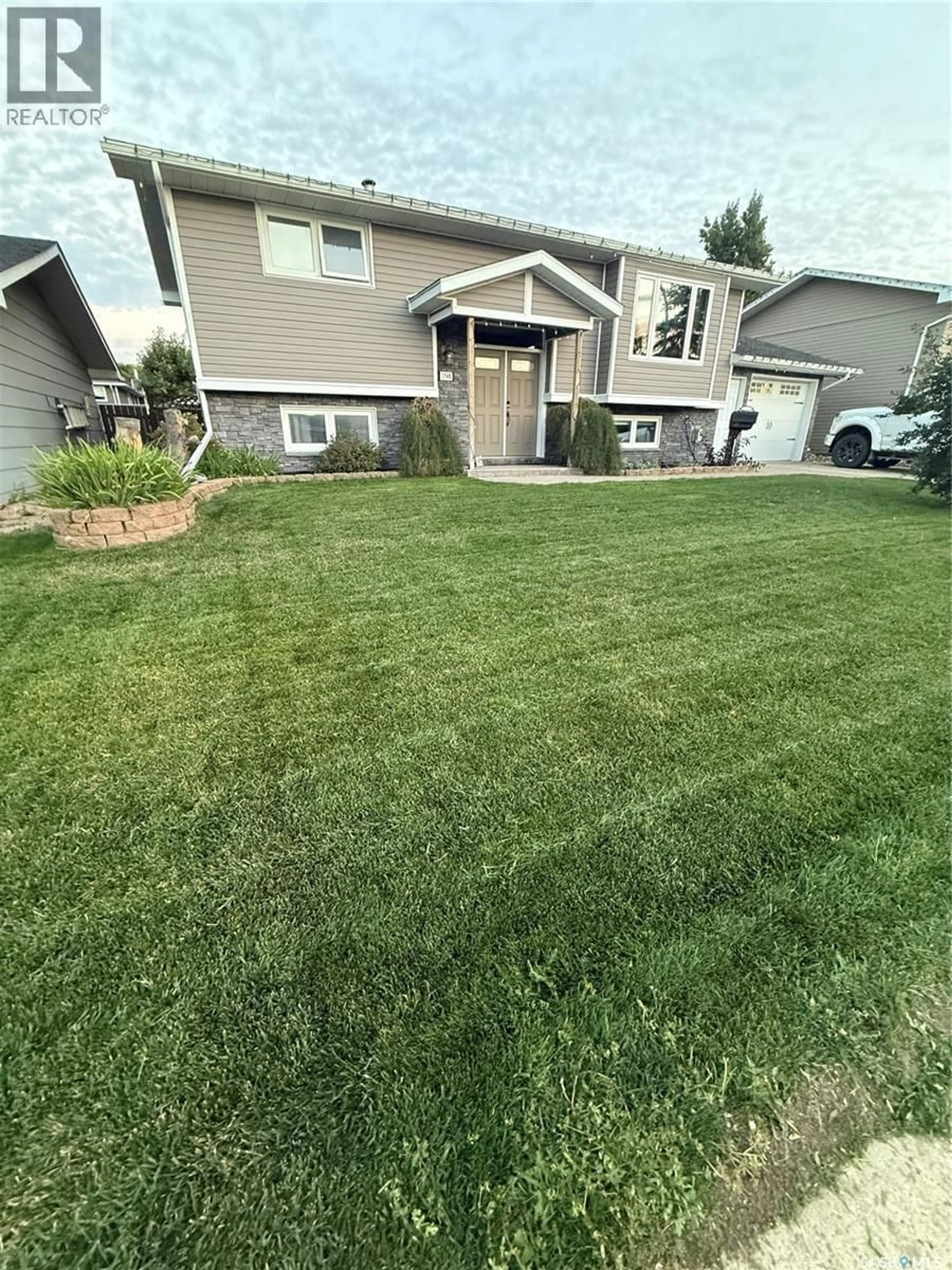 A pic from outside/outdoor area/front of a property/back of a property/a pic from drone, street for 1348 PRINCESS CRESCENT, Moose Jaw Saskatchewan S6H6S9