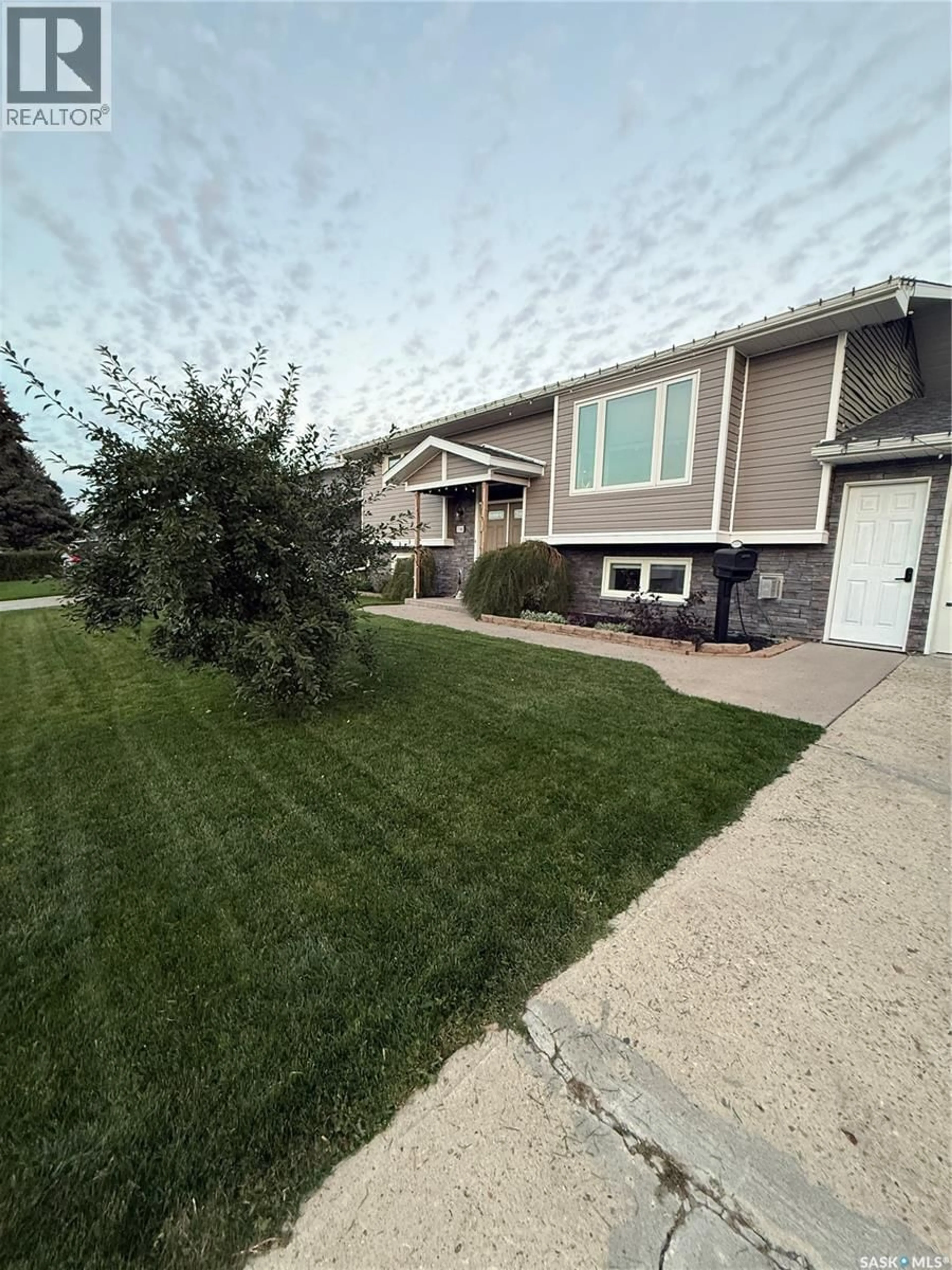 Home with vinyl exterior material, street for 1348 PRINCESS CRESCENT, Moose Jaw Saskatchewan S6H6S9