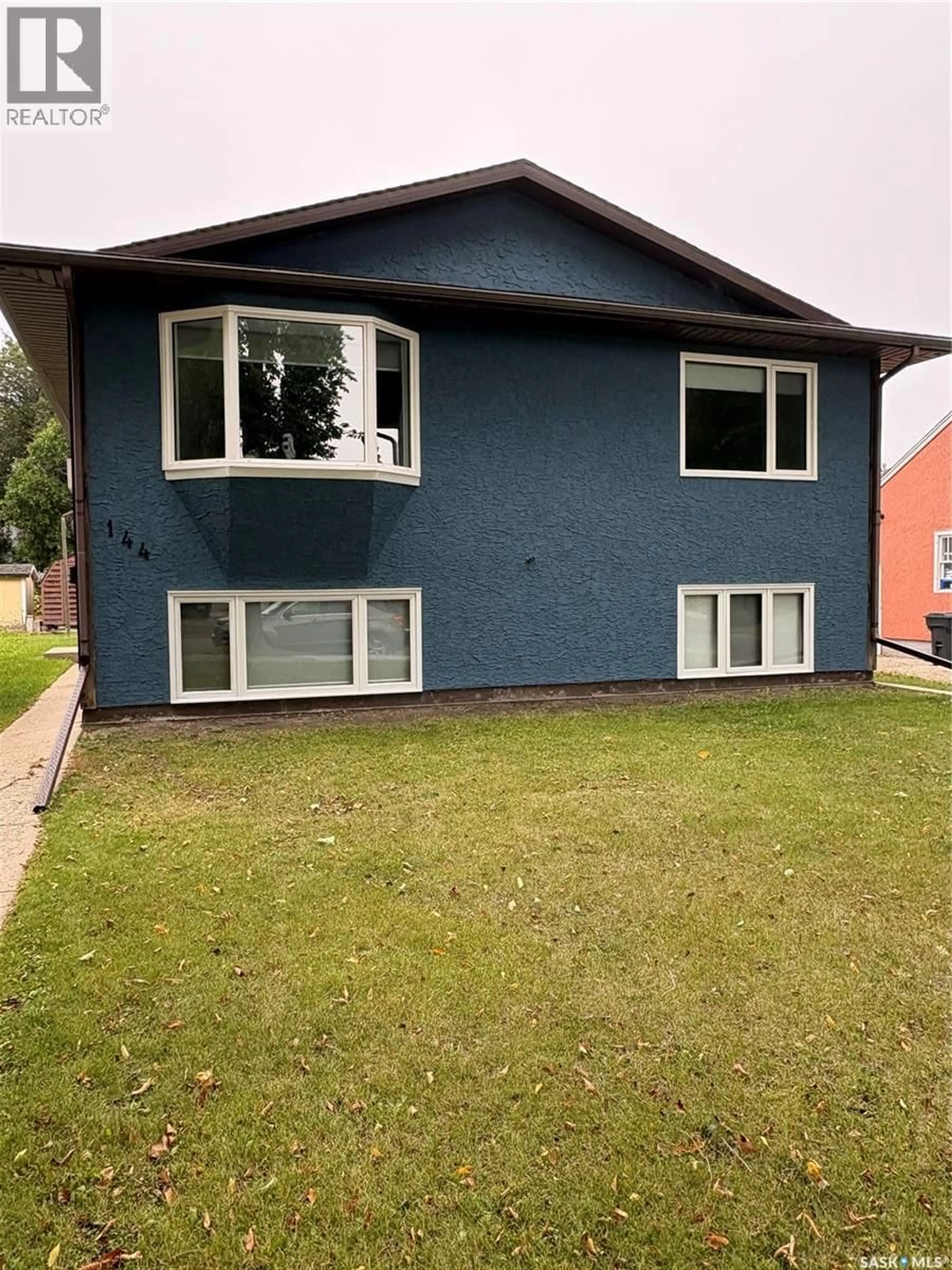Home with vinyl exterior material, street for 144 FIRST AVENUE, Yorkton Saskatchewan S3N1J8