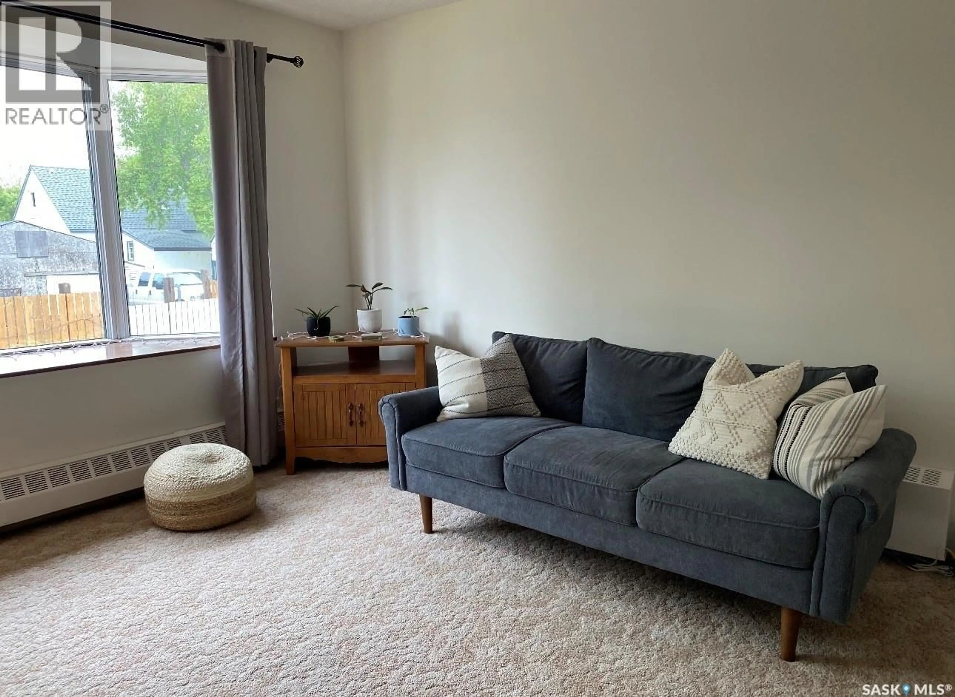 Living room with furniture, carpet floor for 144 FIRST AVENUE, Yorkton Saskatchewan S3N1J8