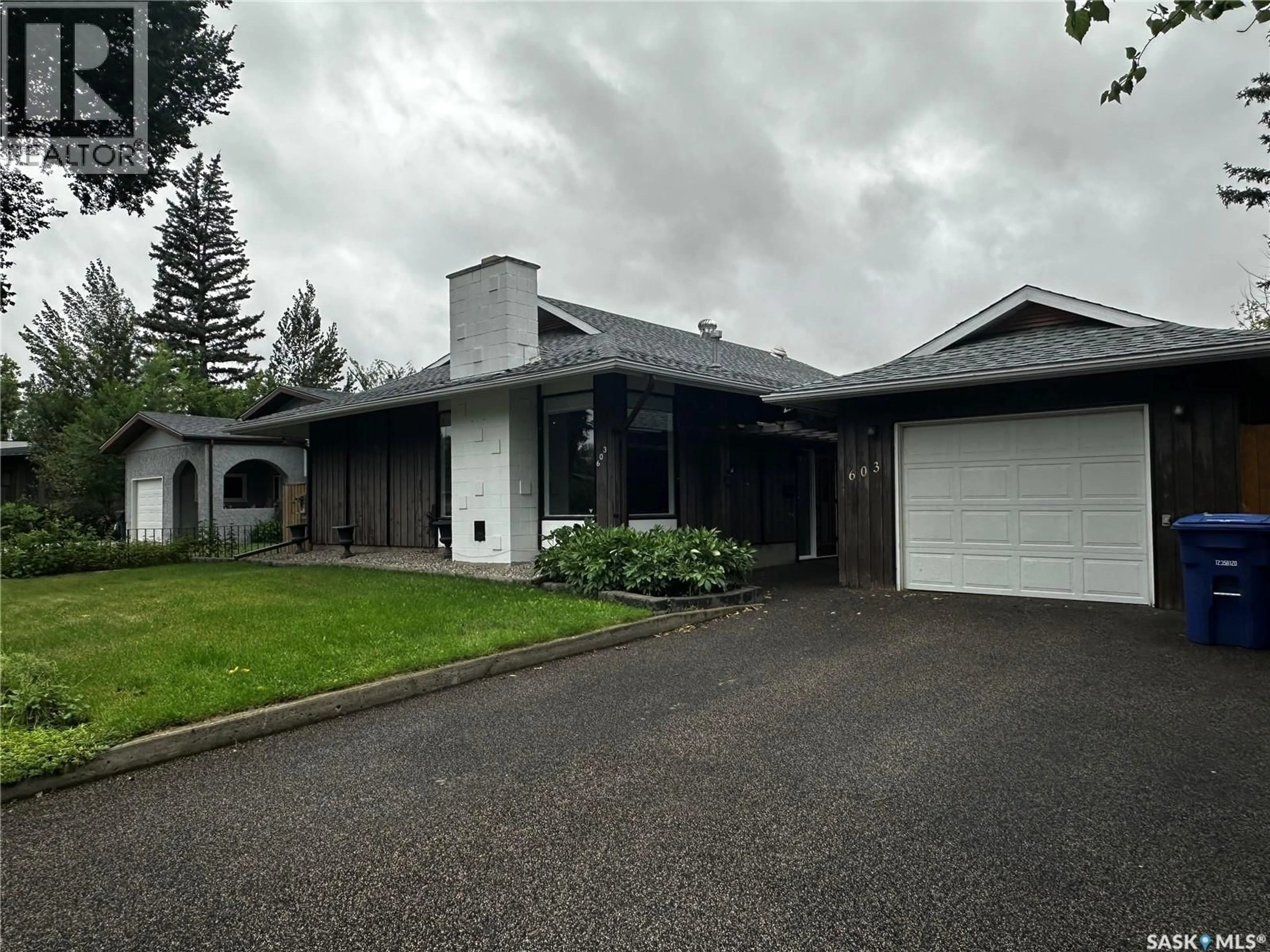 Home with vinyl exterior material, street for 603 3RD AVENUE, Weyburn Saskatchewan S4H1R2