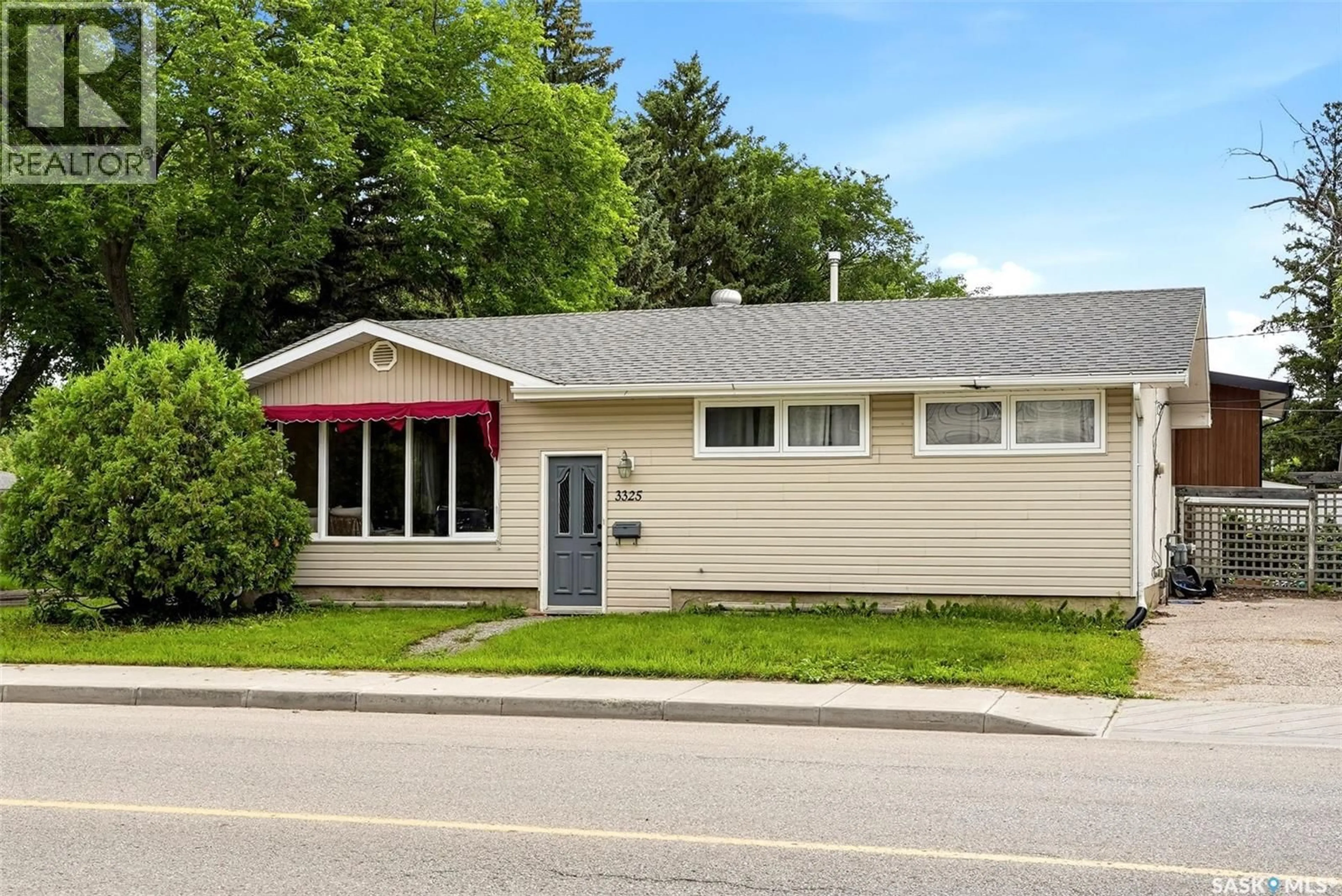 Home with vinyl exterior material, street for 3325 29TH AVENUE, Regina Saskatchewan S4S2P1