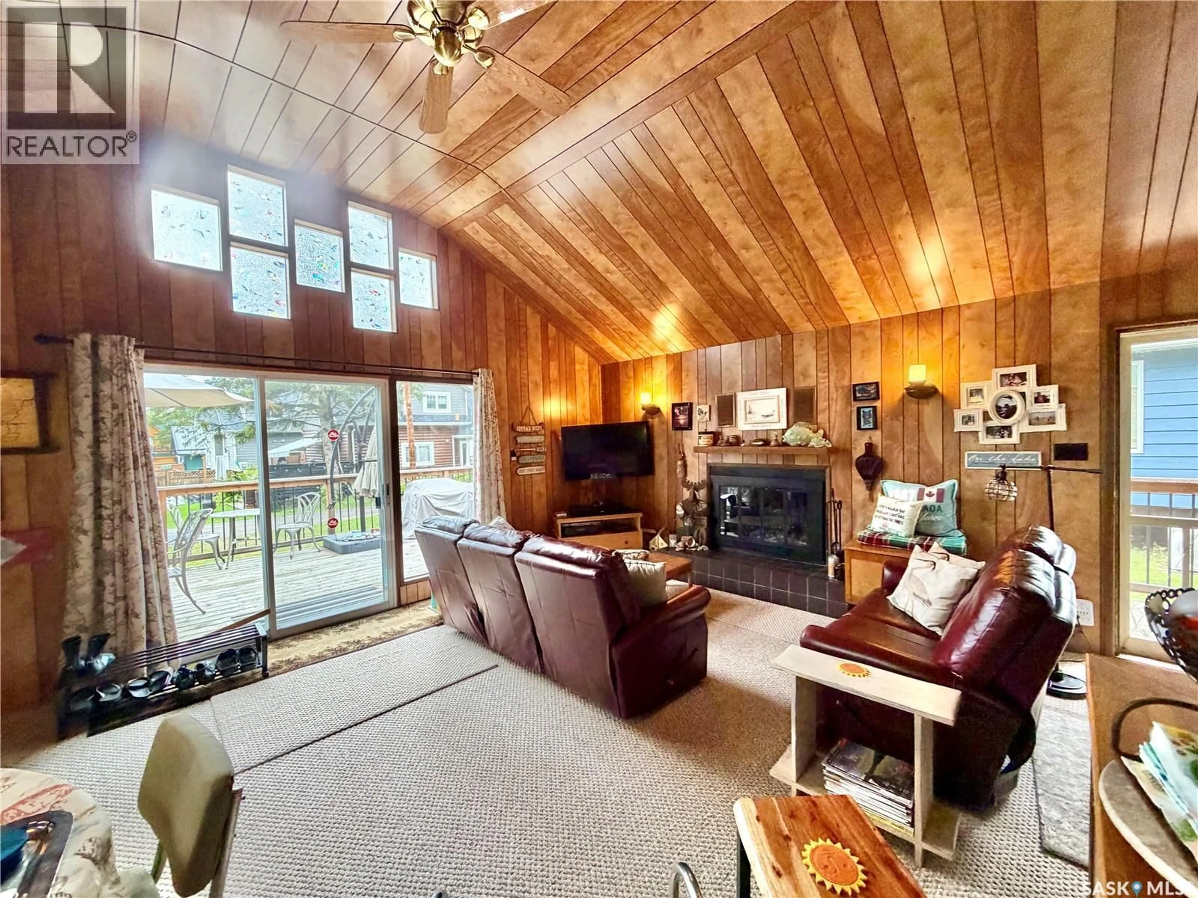 Living room with furniture, wood/laminate floor for 1362 WASKESIU DRIVE, Prince Albert National Park Saskatchewan S0J0N0