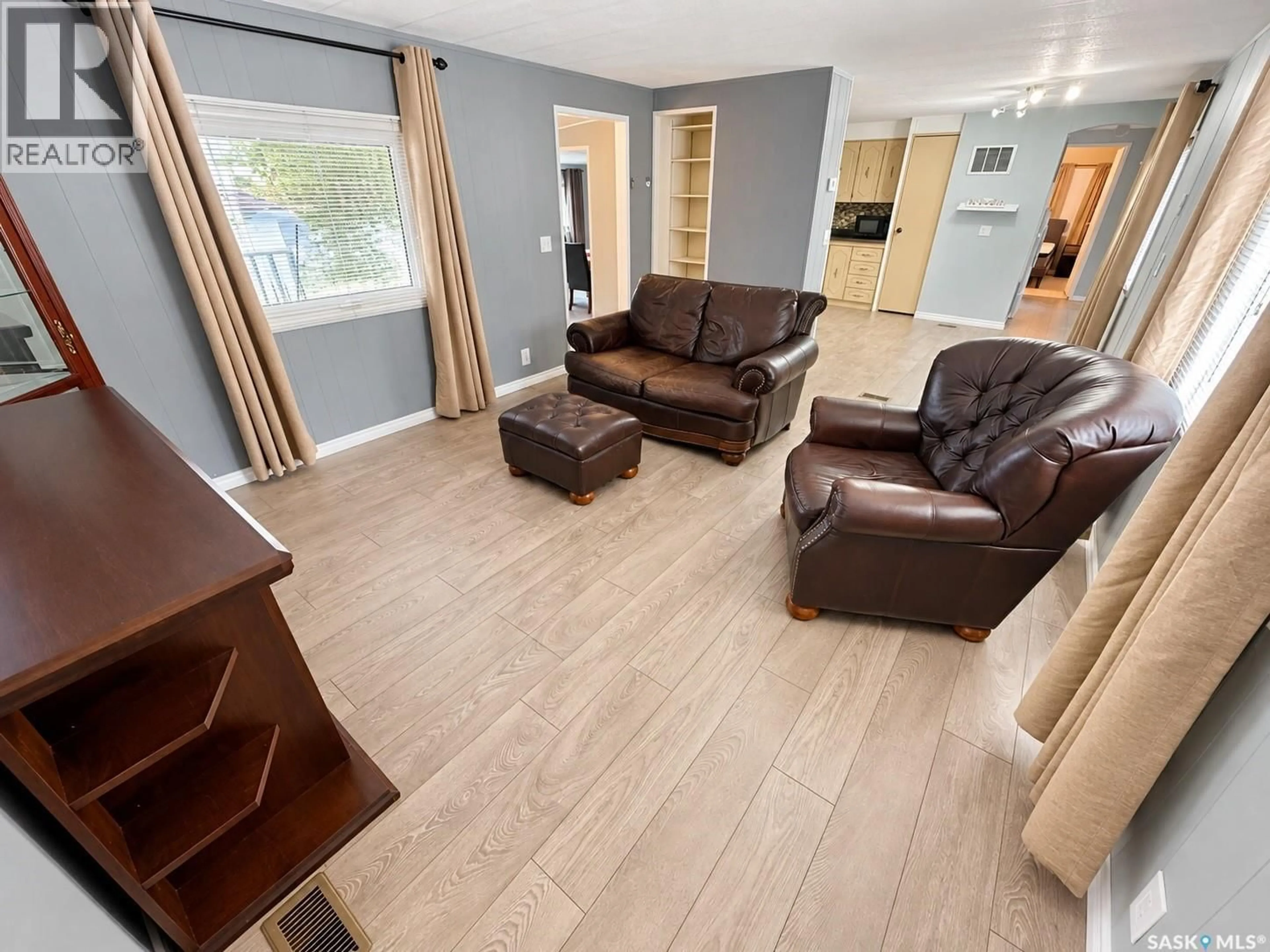 Living room with furniture, unknown for 1746 COTEAU AVENUE, Weyburn Saskatchewan S4H2R7