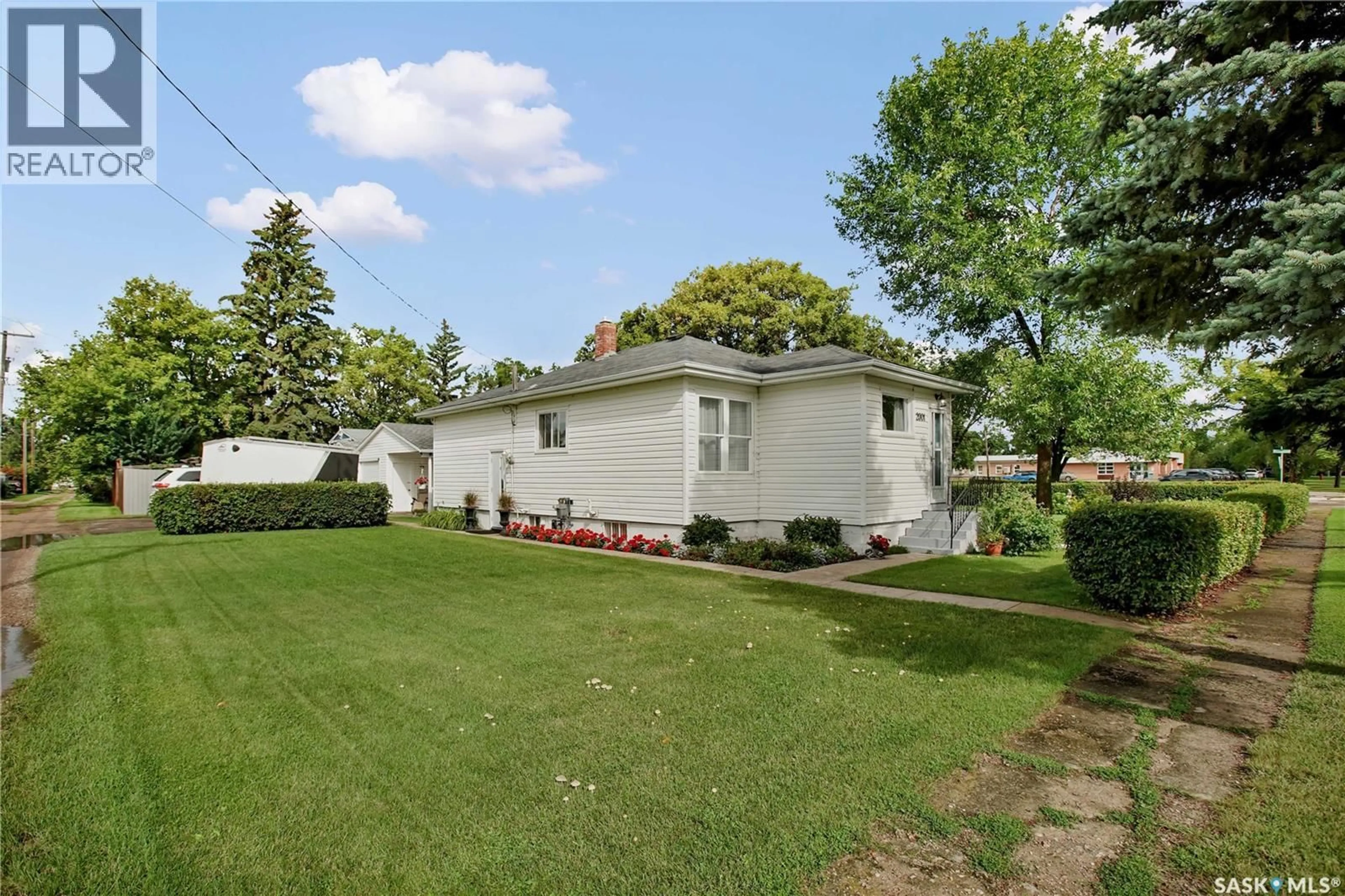 Home with vinyl exterior material, street for 2001 2ND STREET, Rosthern Saskatchewan S0K3R0
