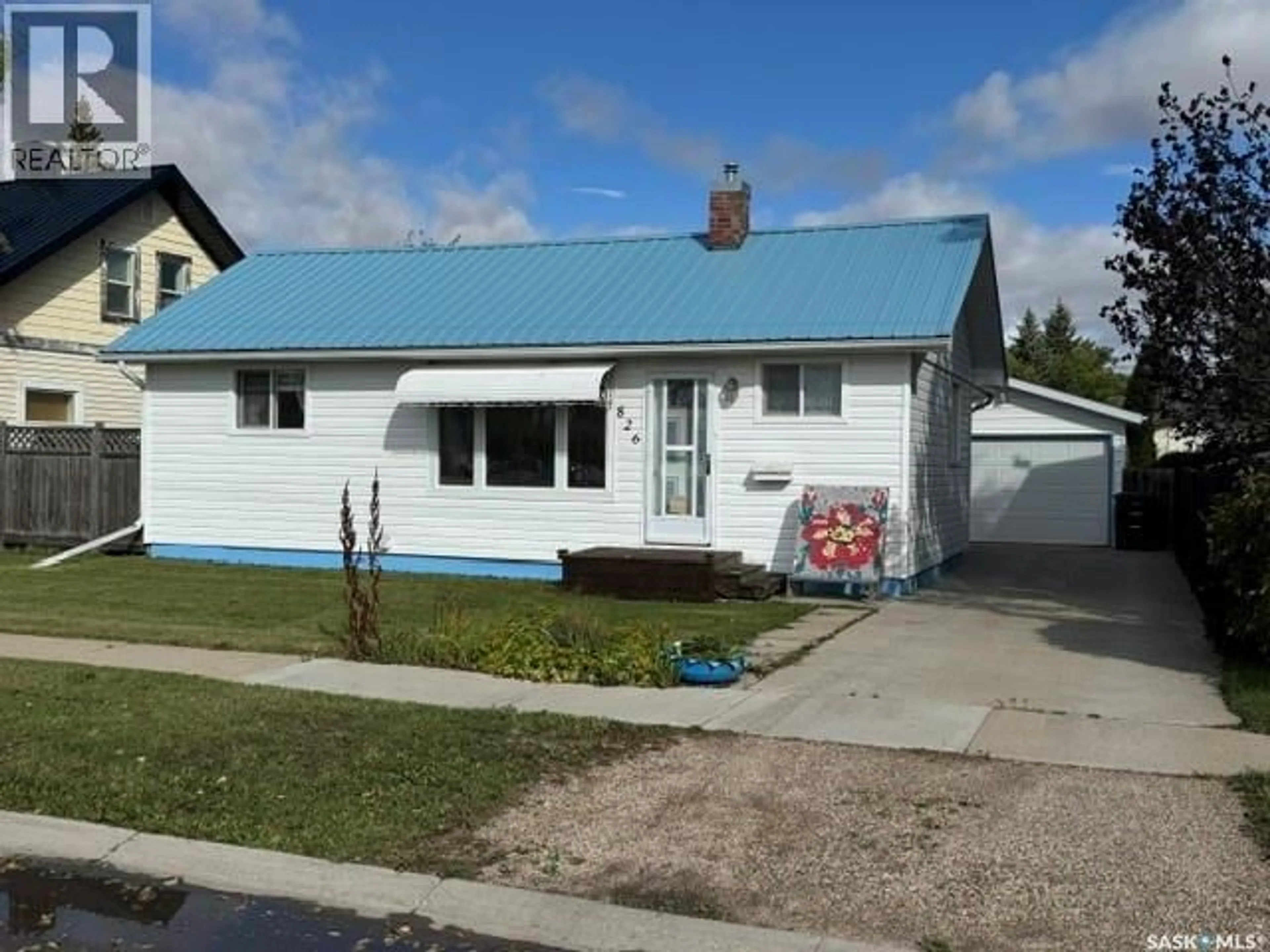Home with vinyl exterior material, street for 826 10TH STREET, Humboldt Saskatchewan S0K2A0