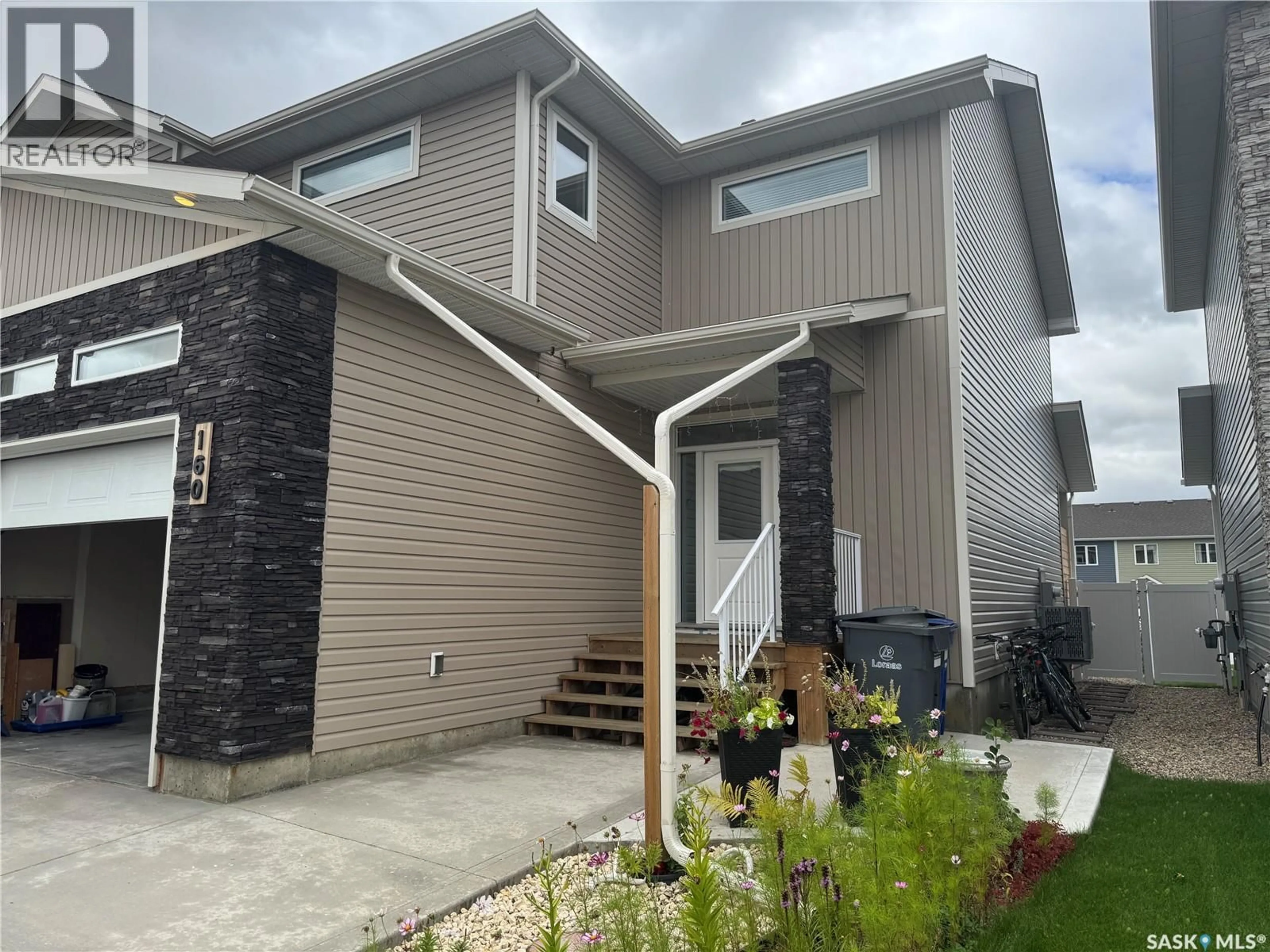 Home with vinyl exterior material, street for 160 ECHO LANE, Martensville Saskatchewan S0K2T1