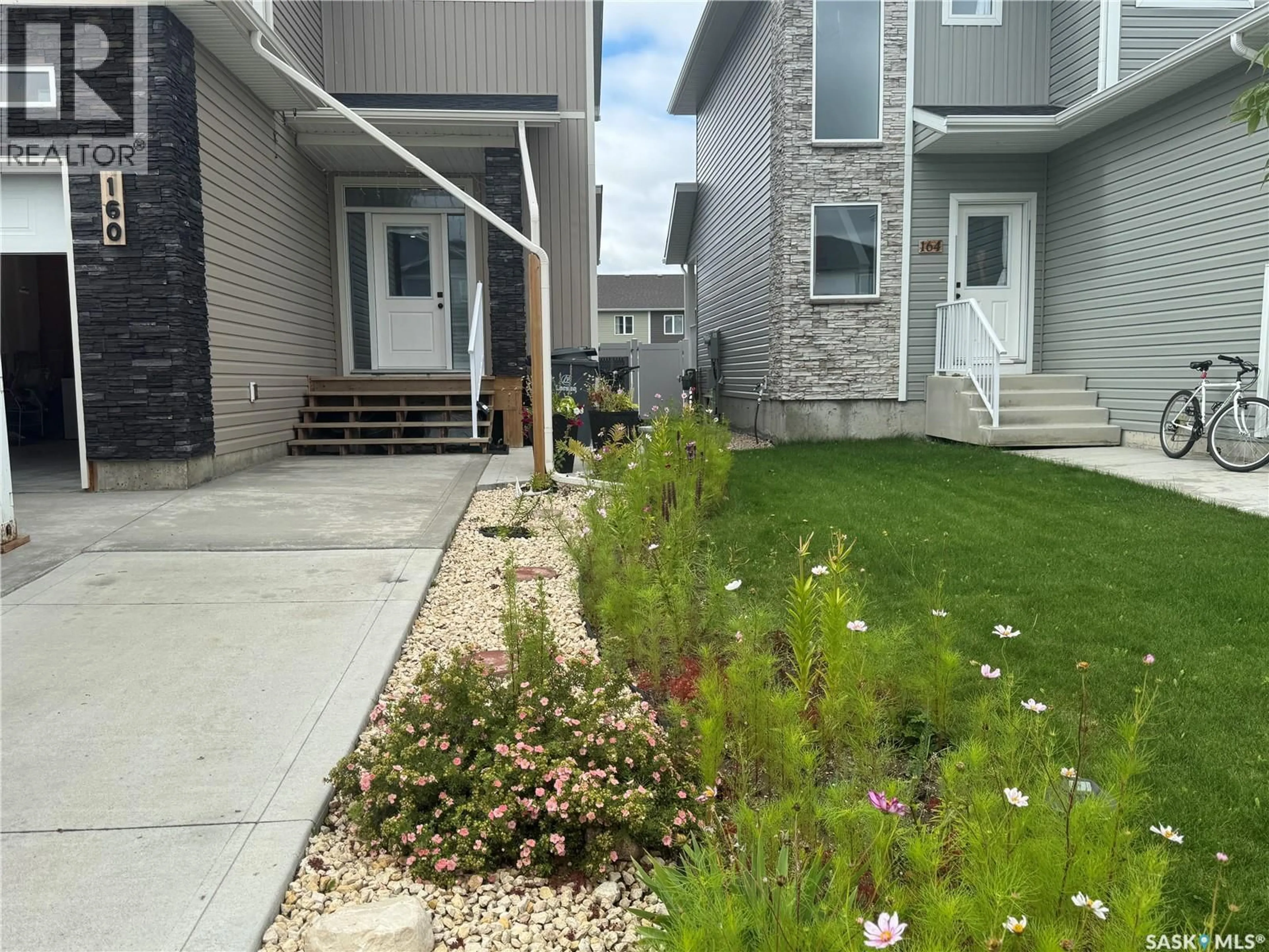A pic from outside/outdoor area/front of a property/back of a property/a pic from drone, street for 160 ECHO LANE, Martensville Saskatchewan S0K2T1
