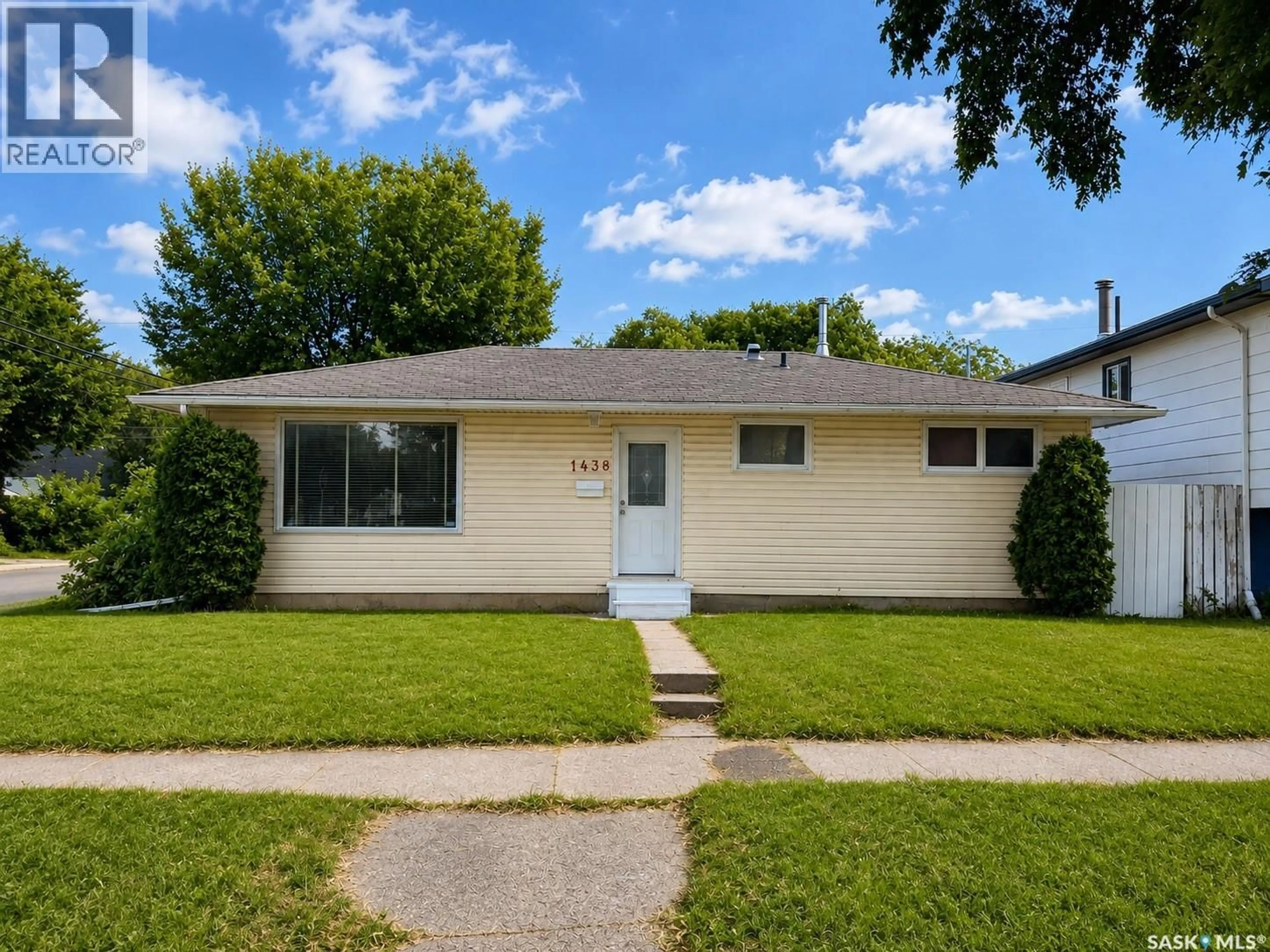 Home with vinyl exterior material, street for 1438 D AVENUE, Saskatoon Saskatchewan S7L1P4
