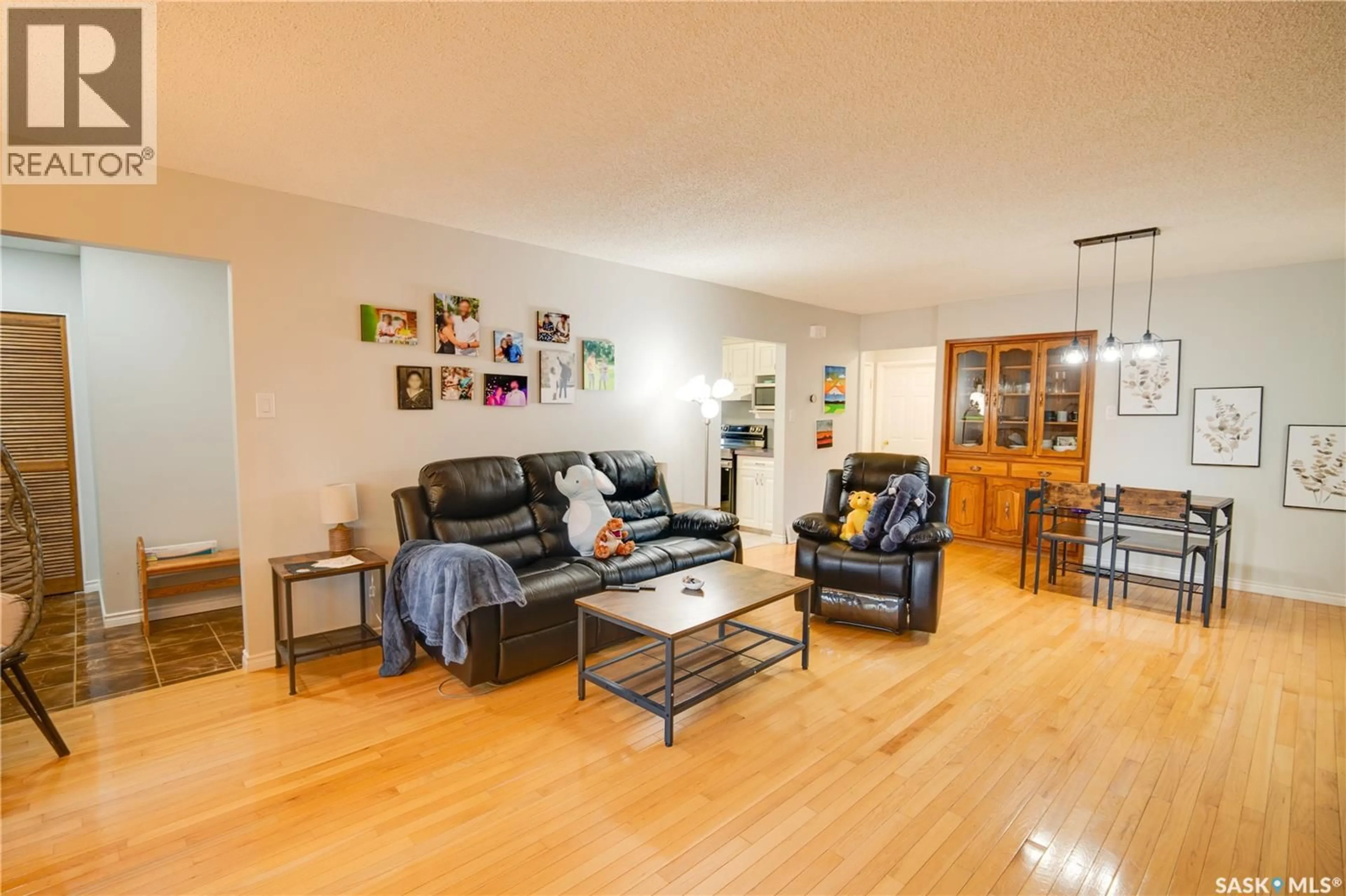Living room with furniture, wood/laminate floor for 1304 QUEEN CRESCENT, Moose Jaw Saskatchewan S6H3G4