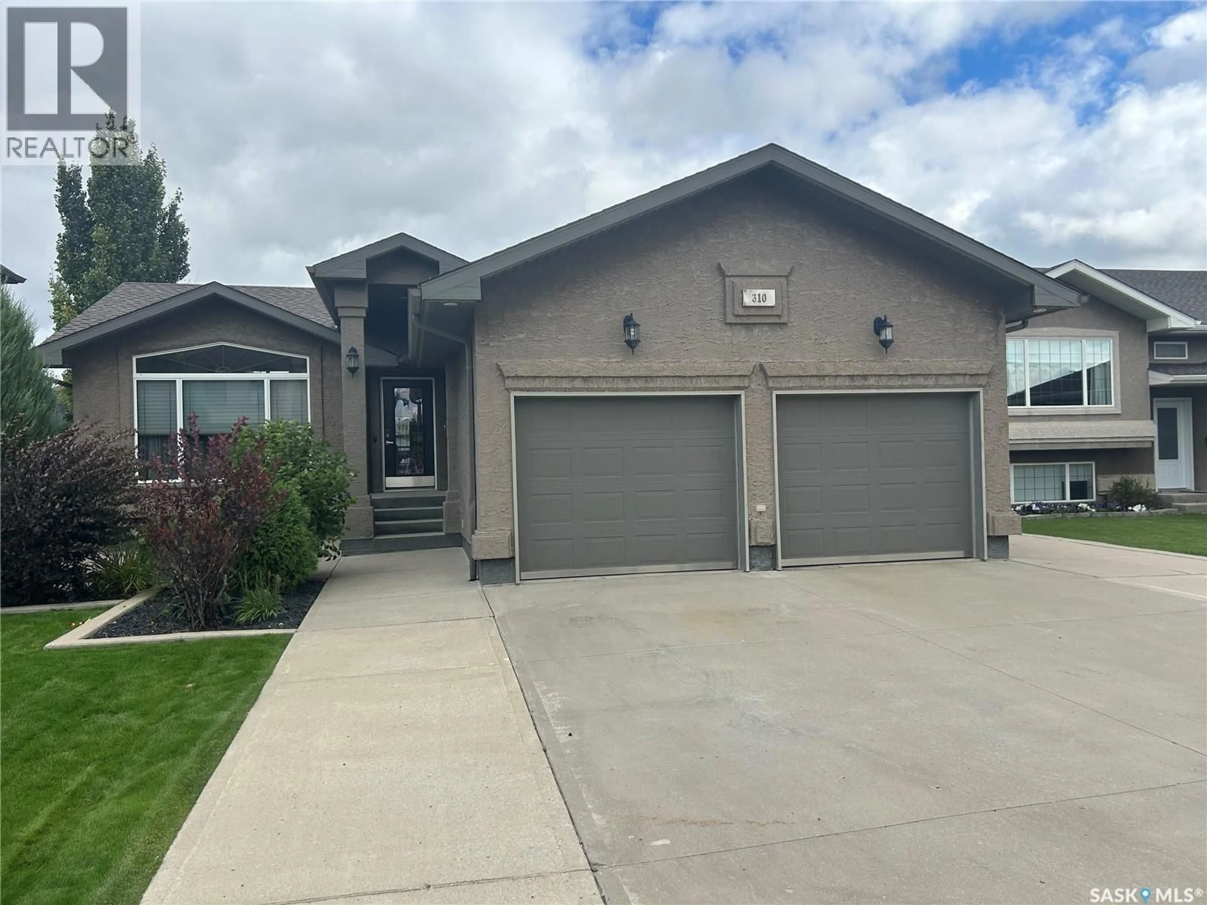 Home with vinyl exterior material, street for 310 BROOKS ROAD, Estevan Saskatchewan S4A2X2