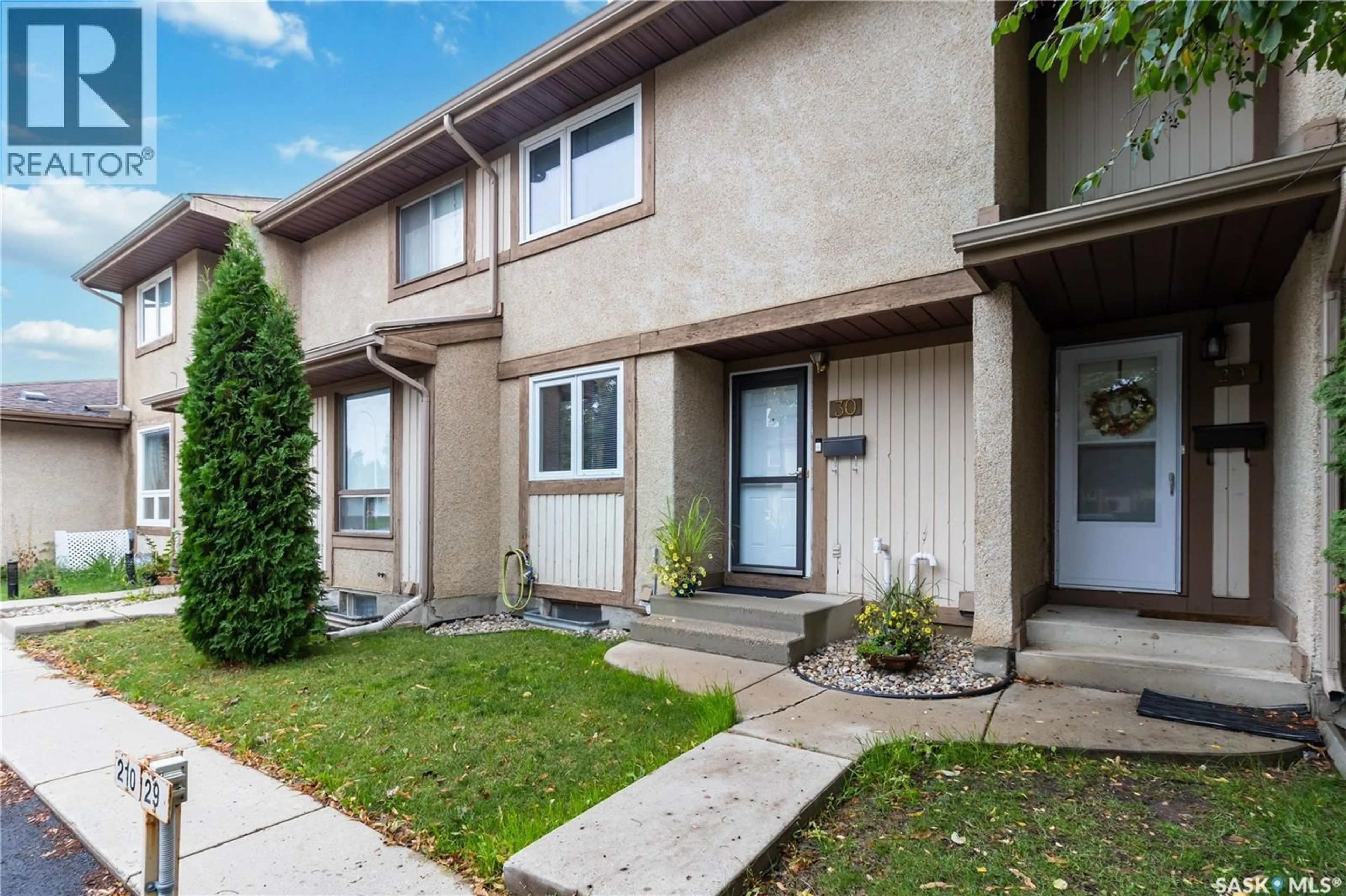 Home with vinyl exterior material, street for 1128 - 30 MCKERCHER DRIVE, Saskatoon Saskatchewan S7H4Y7