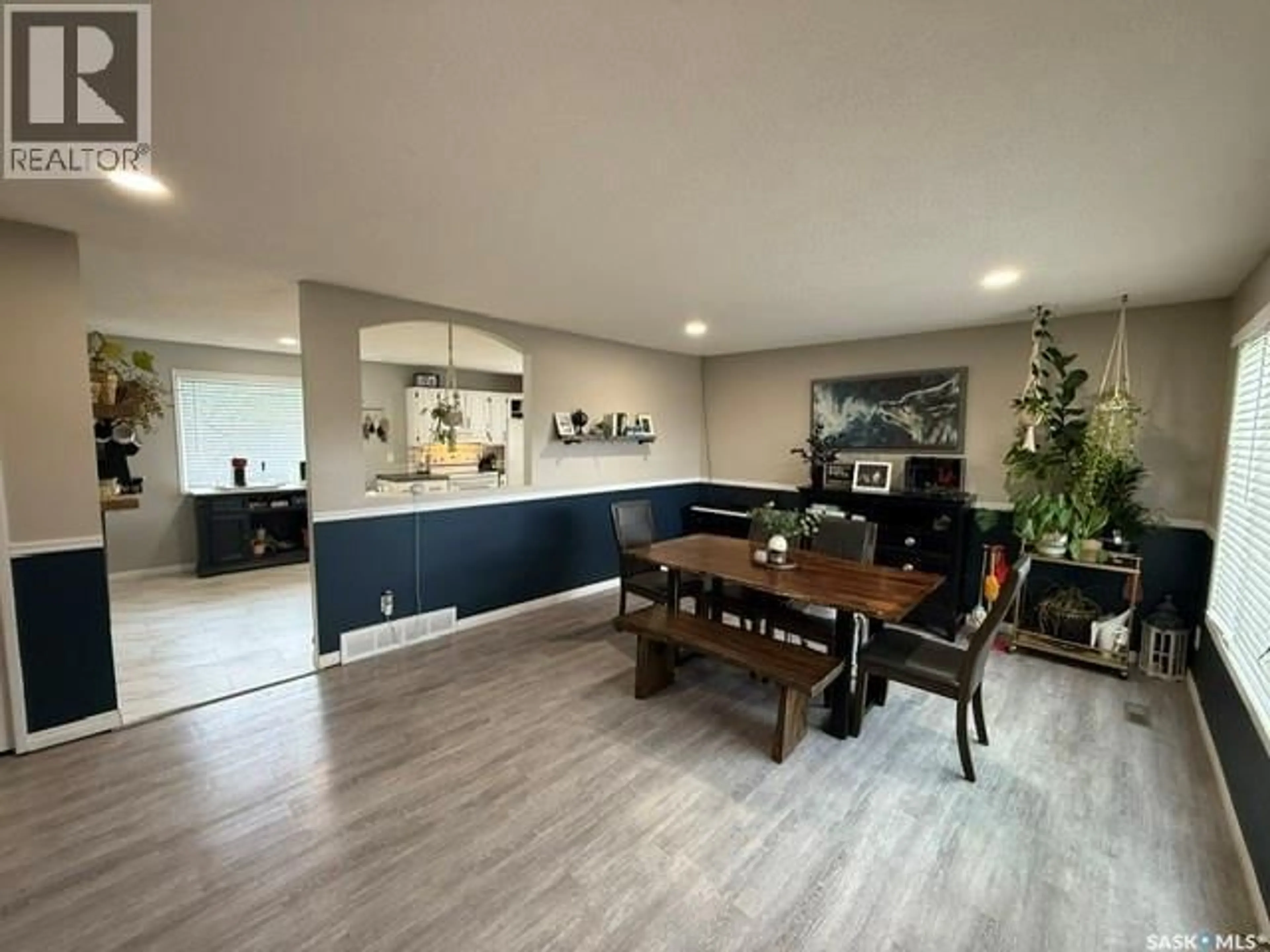 Open concept kitchen, wood/laminate floor for 208 EAST AVENUE, Kamsack Saskatchewan S0A1S0