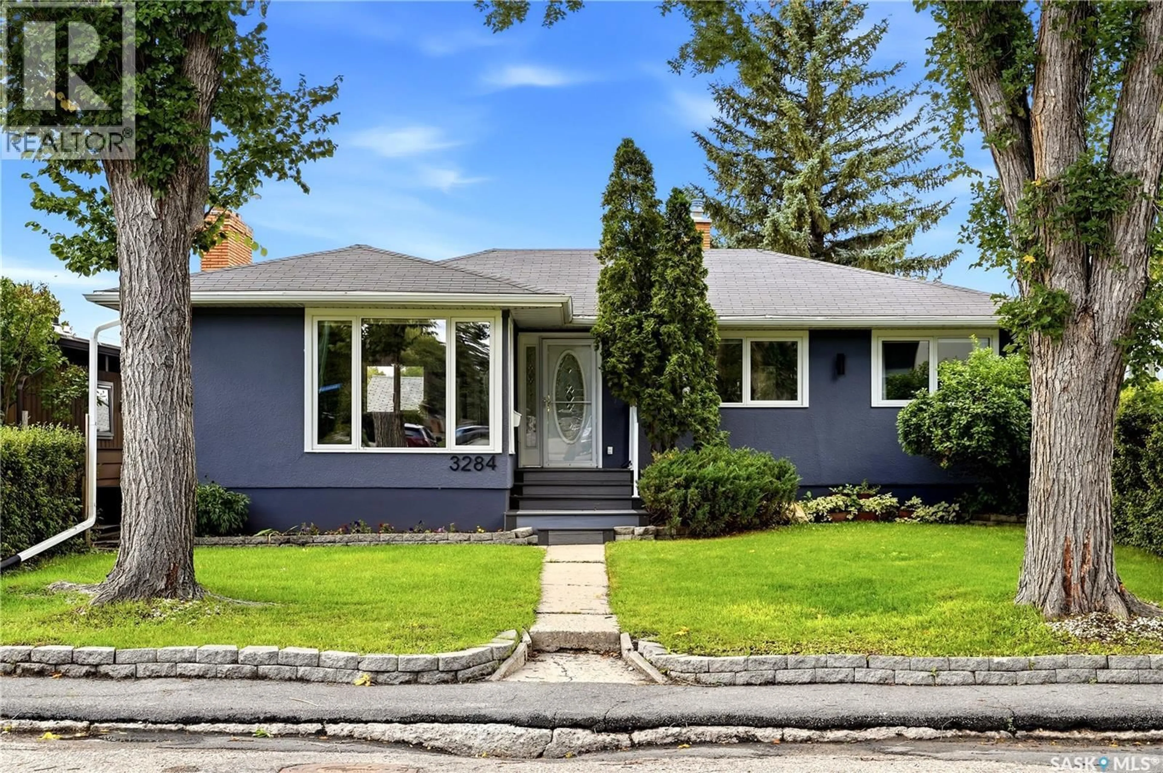 Home with vinyl exterior material, street for 3284 ROBINSON STREET, Regina Saskatchewan S4S1V7