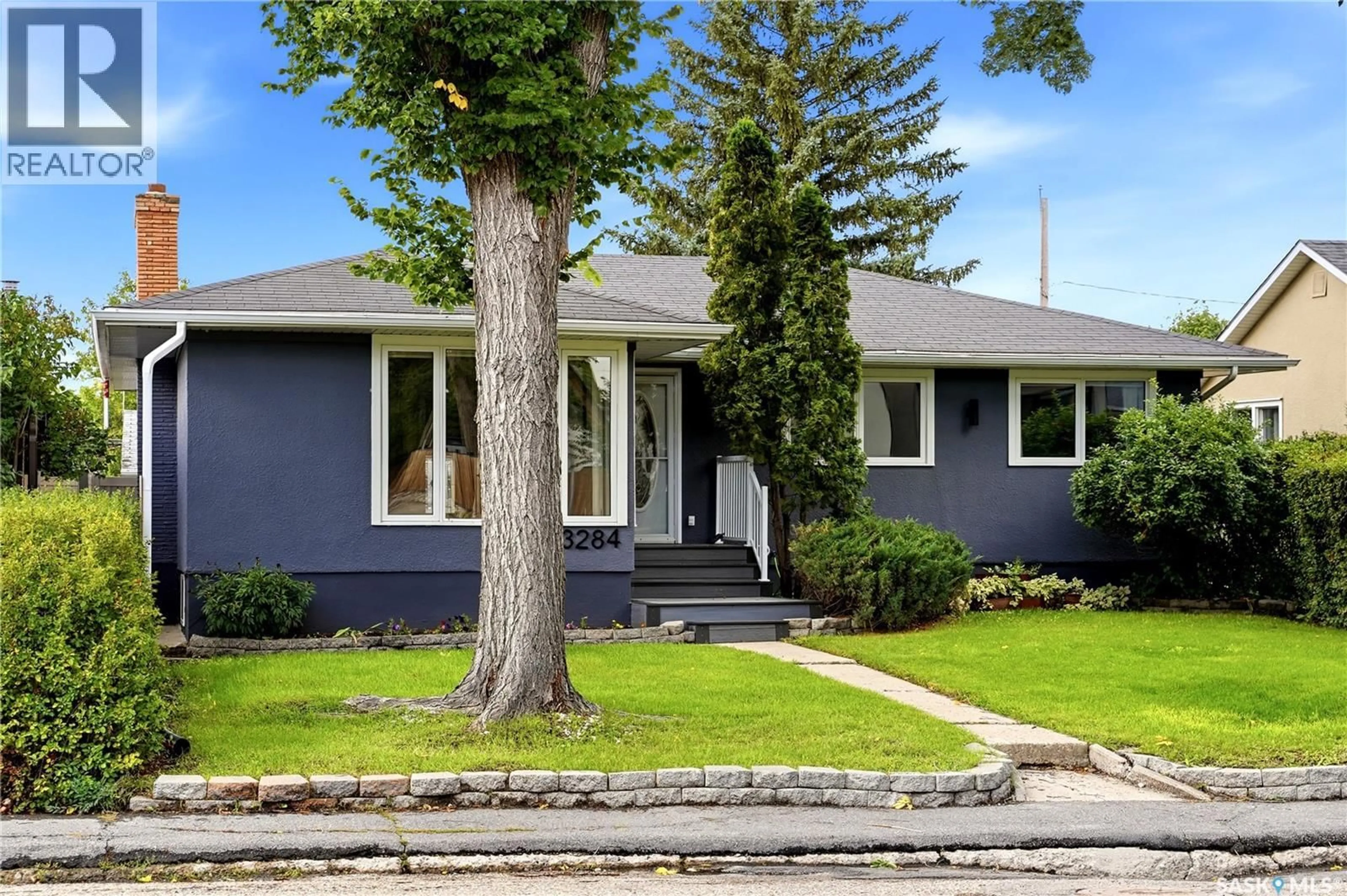 Home with vinyl exterior material, street for 3284 ROBINSON STREET, Regina Saskatchewan S4S1V7