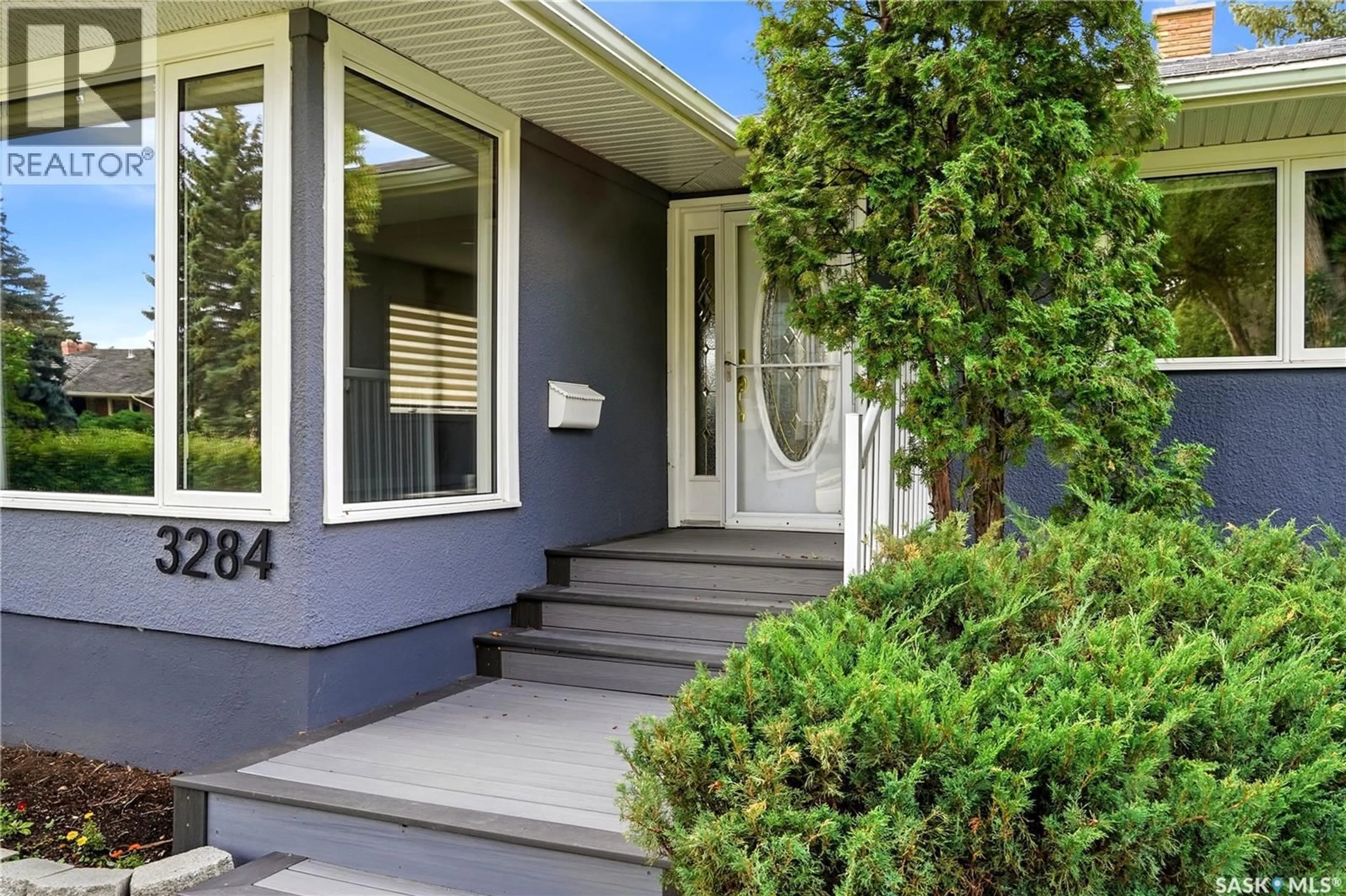 Home with vinyl exterior material, street for 3284 ROBINSON STREET, Regina Saskatchewan S4S1V7