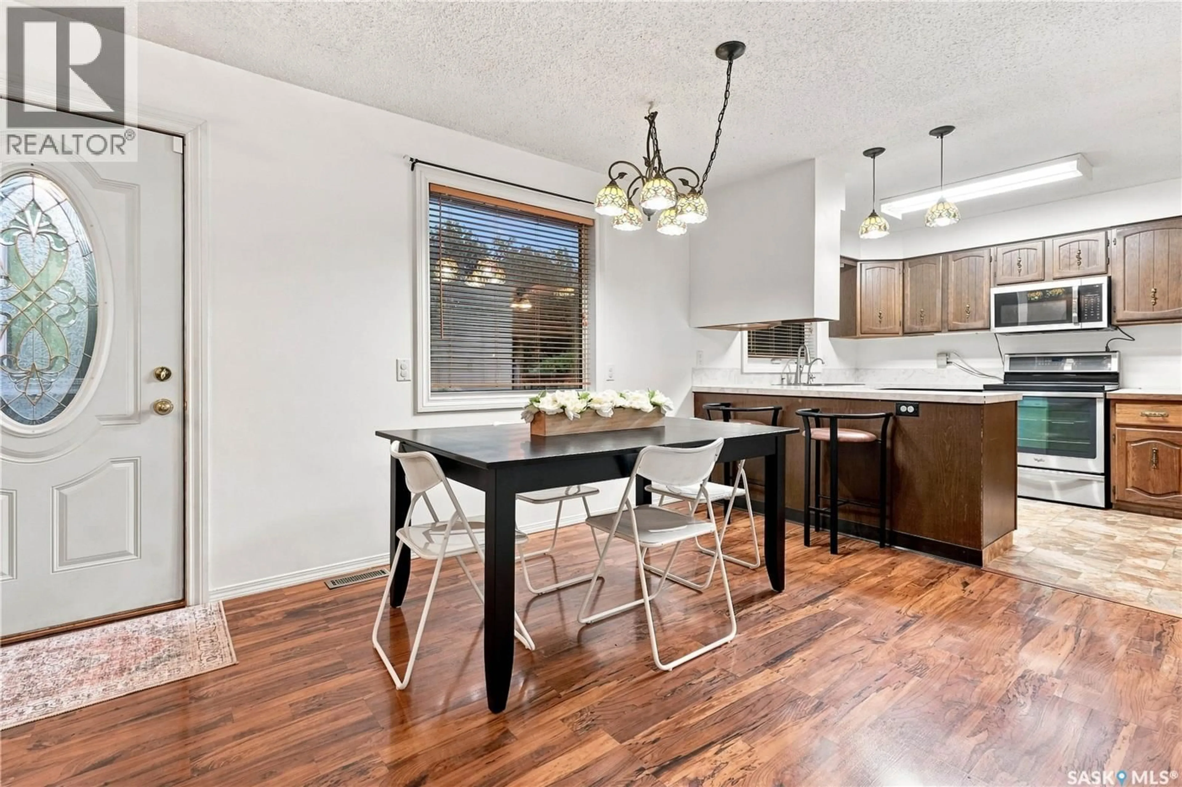 Open concept kitchen, wood/laminate floor for 102 CAMPKIN STREET, Francis Saskatchewan S0G1V0