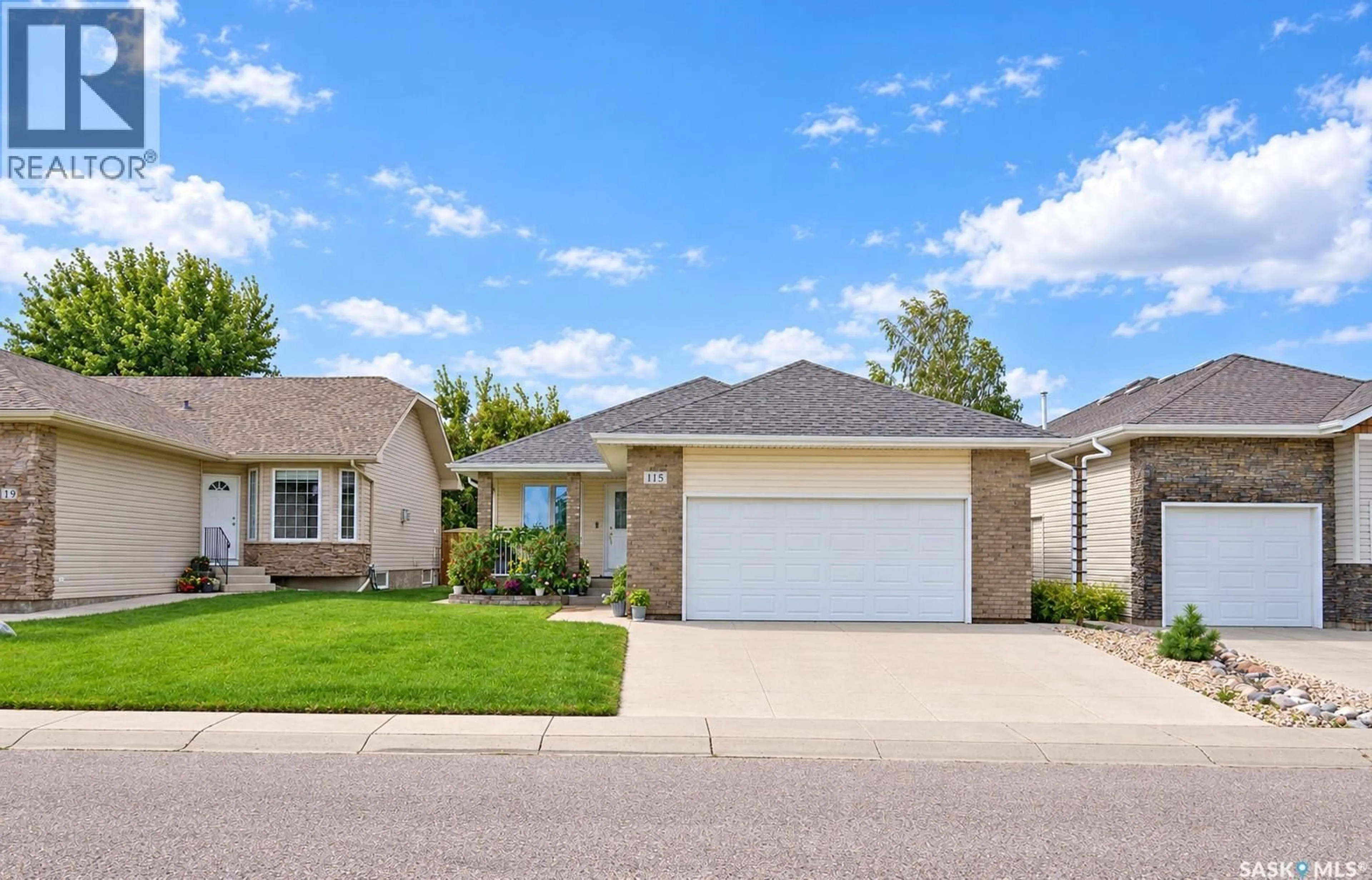 Home with vinyl exterior material, street for 115 MARTIN CRESCENT, Saskatoon Saskatchewan S7T0A1