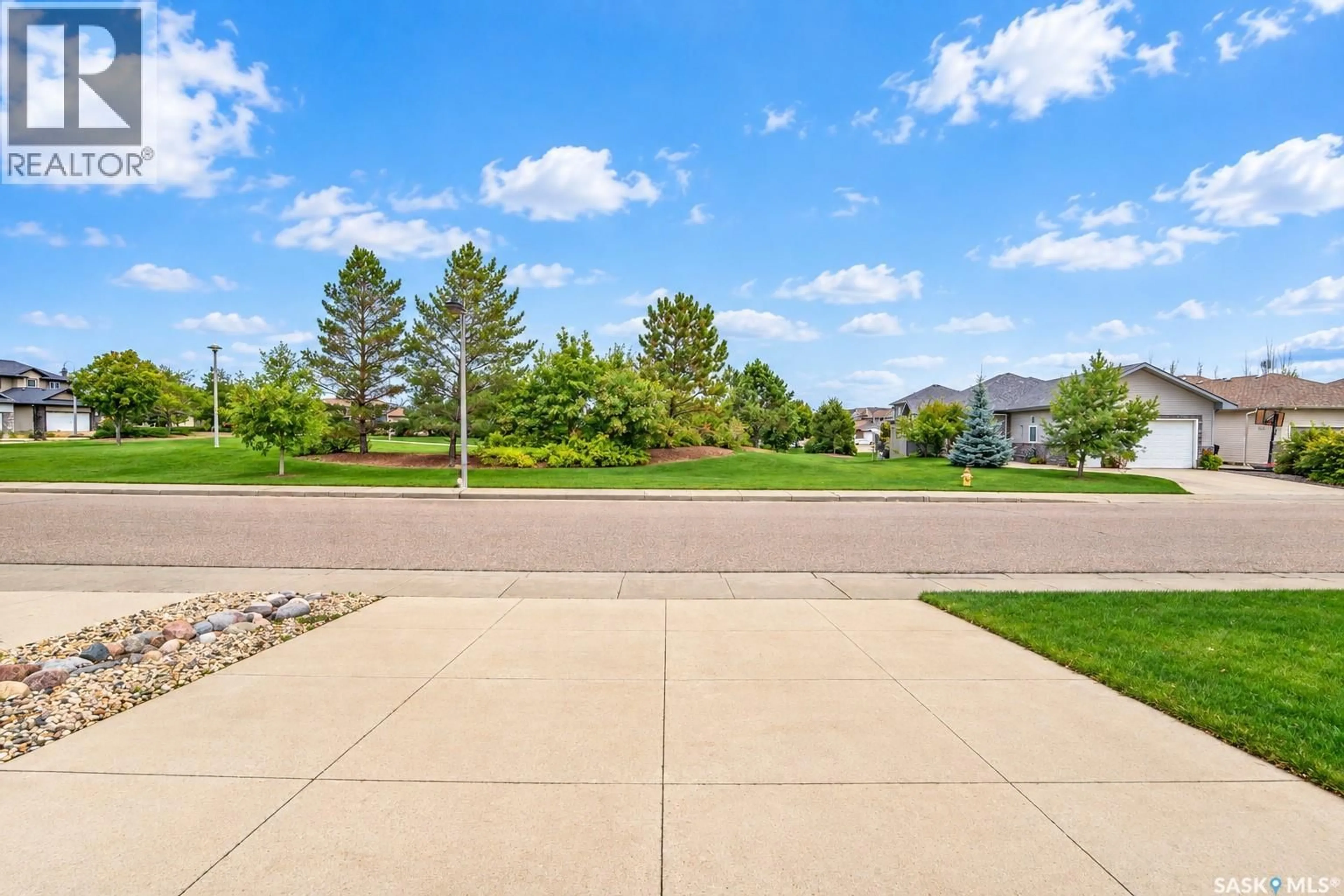 Patio, water/lake/river/ocean view for 115 MARTIN CRESCENT, Saskatoon Saskatchewan S7T0A1