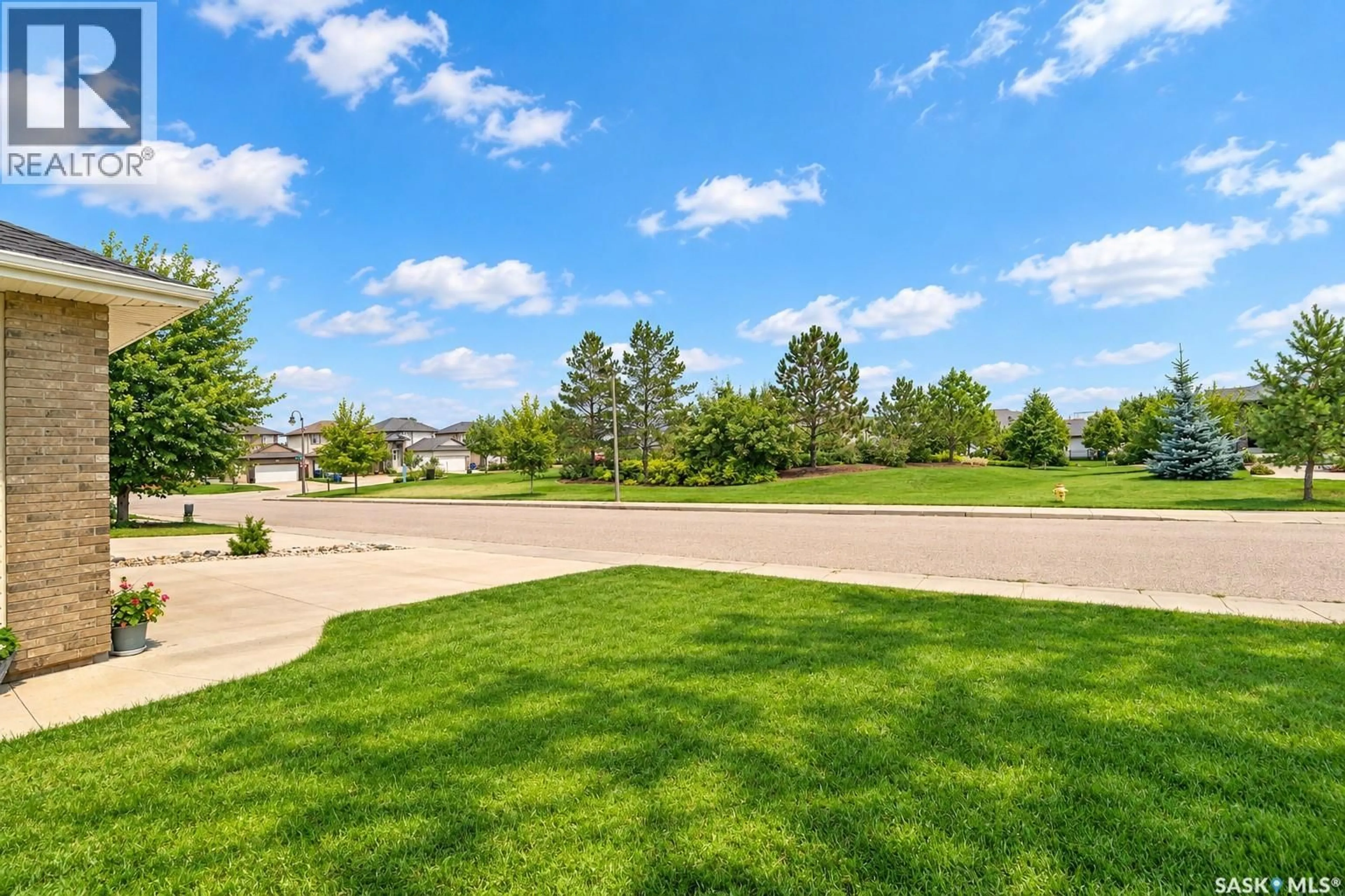 A pic from outside/outdoor area/front of a property/back of a property/a pic from drone, water/lake/river/ocean view for 115 MARTIN CRESCENT, Saskatoon Saskatchewan S7T0A1