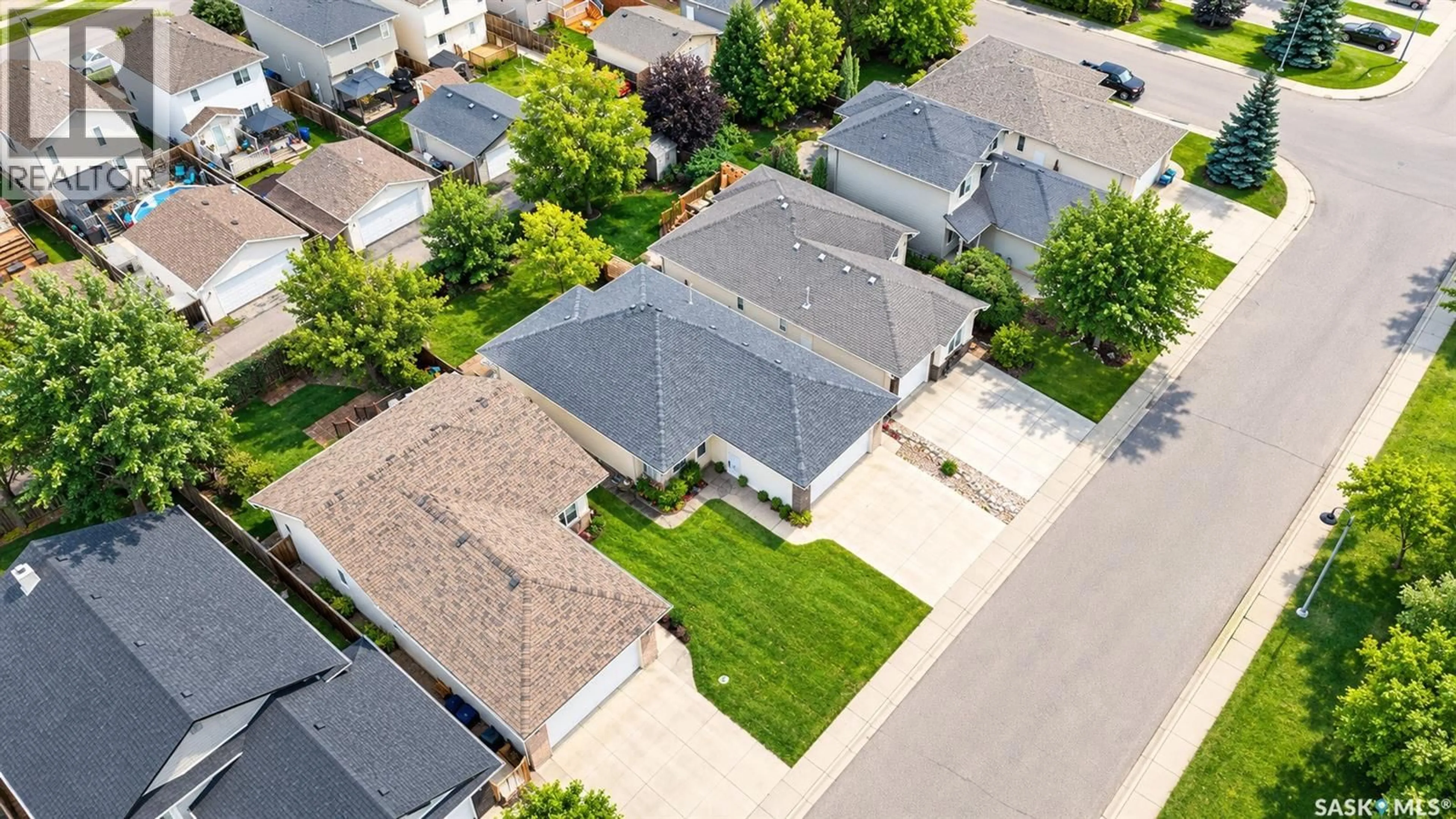 A pic from outside/outdoor area/front of a property/back of a property/a pic from drone, street for 115 MARTIN CRESCENT, Saskatoon Saskatchewan S7T0A1