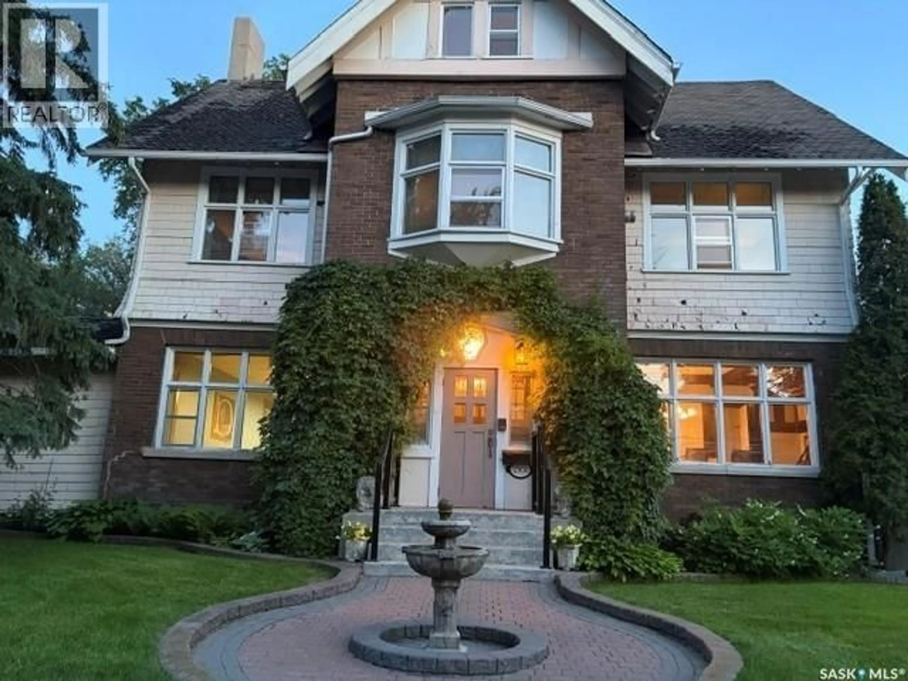 Home with brick exterior material, street for 2301 15TH AVENUE, Regina Saskatchewan S4P1A3
