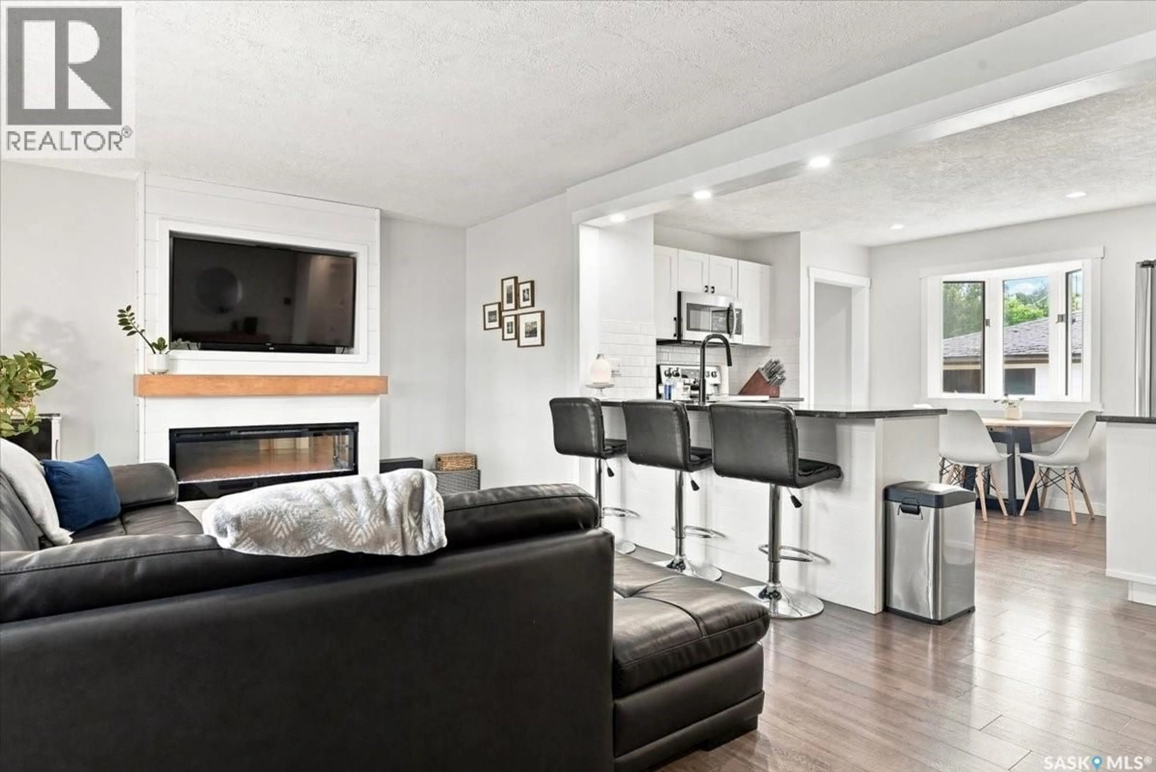 Living room with furniture, wood/laminate floor for 724 HORACE STREET, Regina Saskatchewan S4T5K6