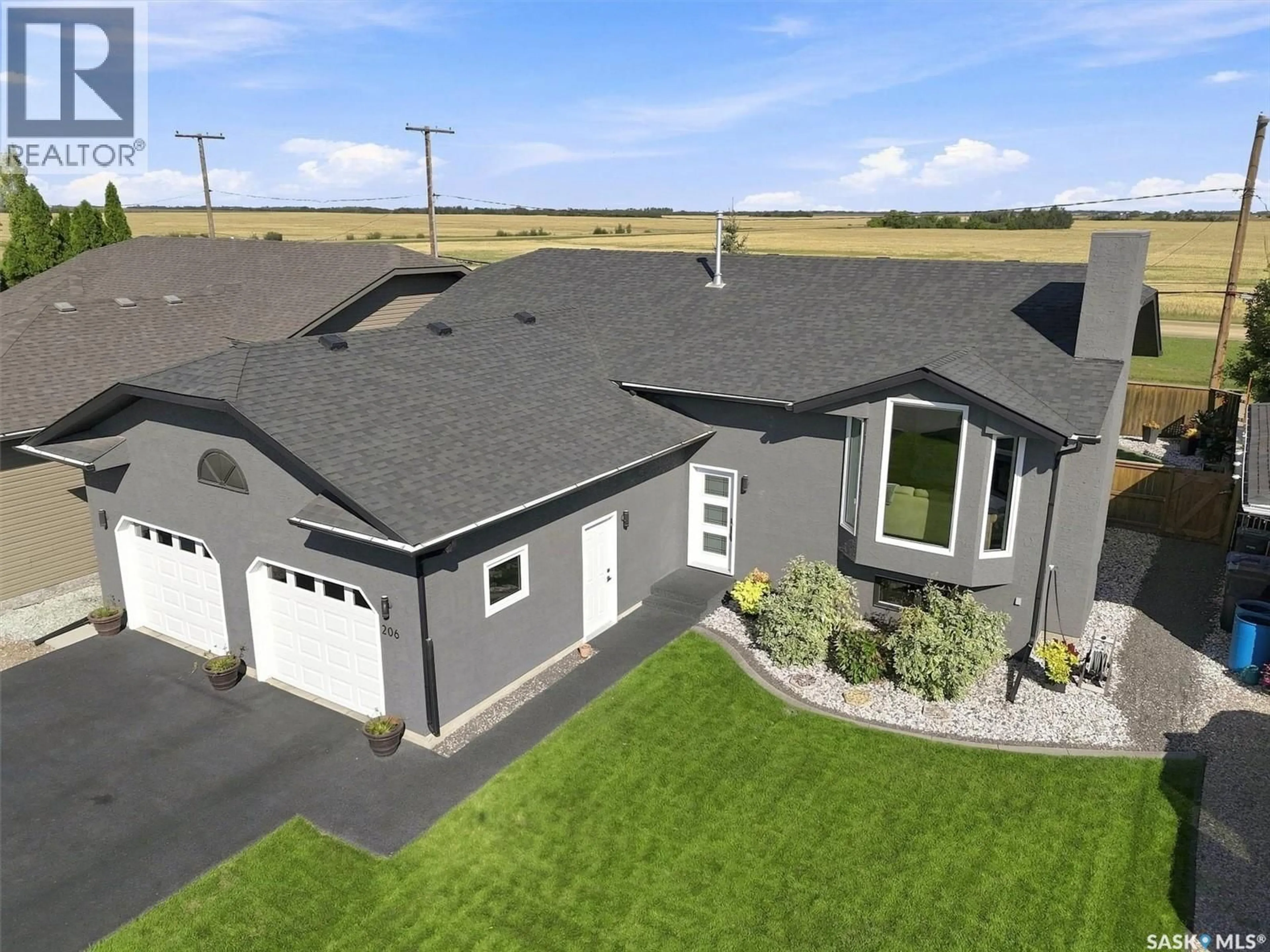 A pic from outside/outdoor area/front of a property/back of a property/a pic from drone, unknown for 206 VICTOR TERRACE, Dalmeny Saskatchewan S0K1E0