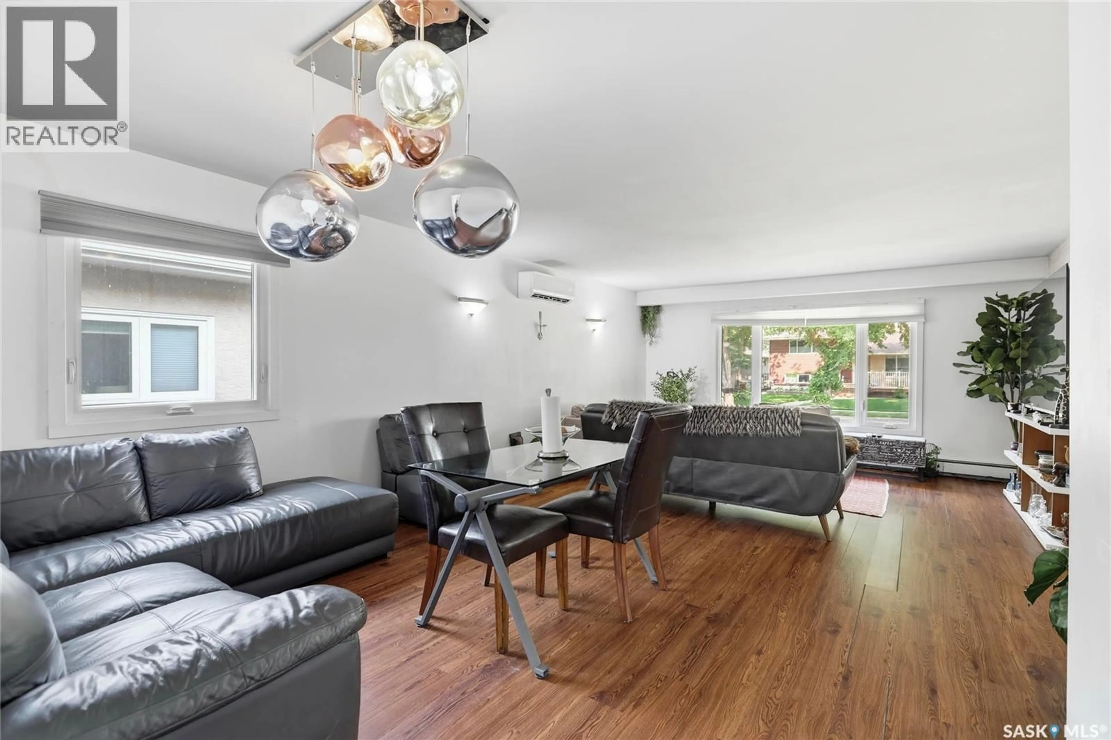 Living room with furniture, wood/laminate floor for 1960 COWAN CRESCENT, Regina Saskatchewan S4S4C6
