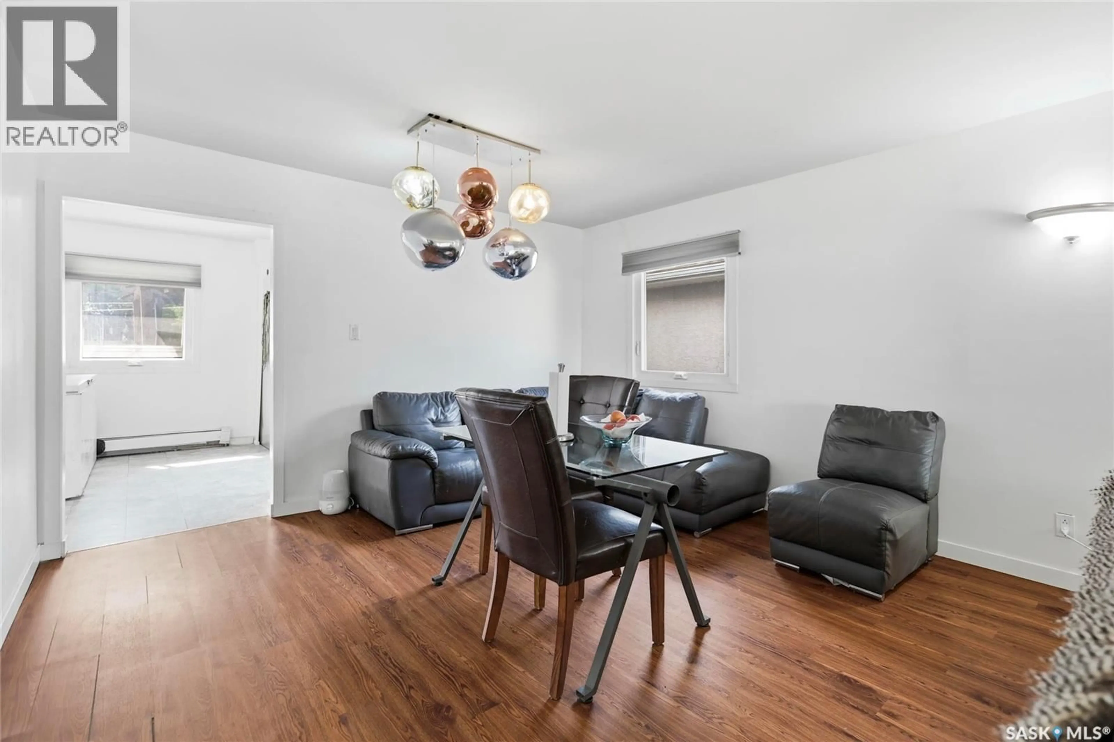 Living room with furniture, wood/laminate floor for 1960 COWAN CRESCENT, Regina Saskatchewan S4S4C6