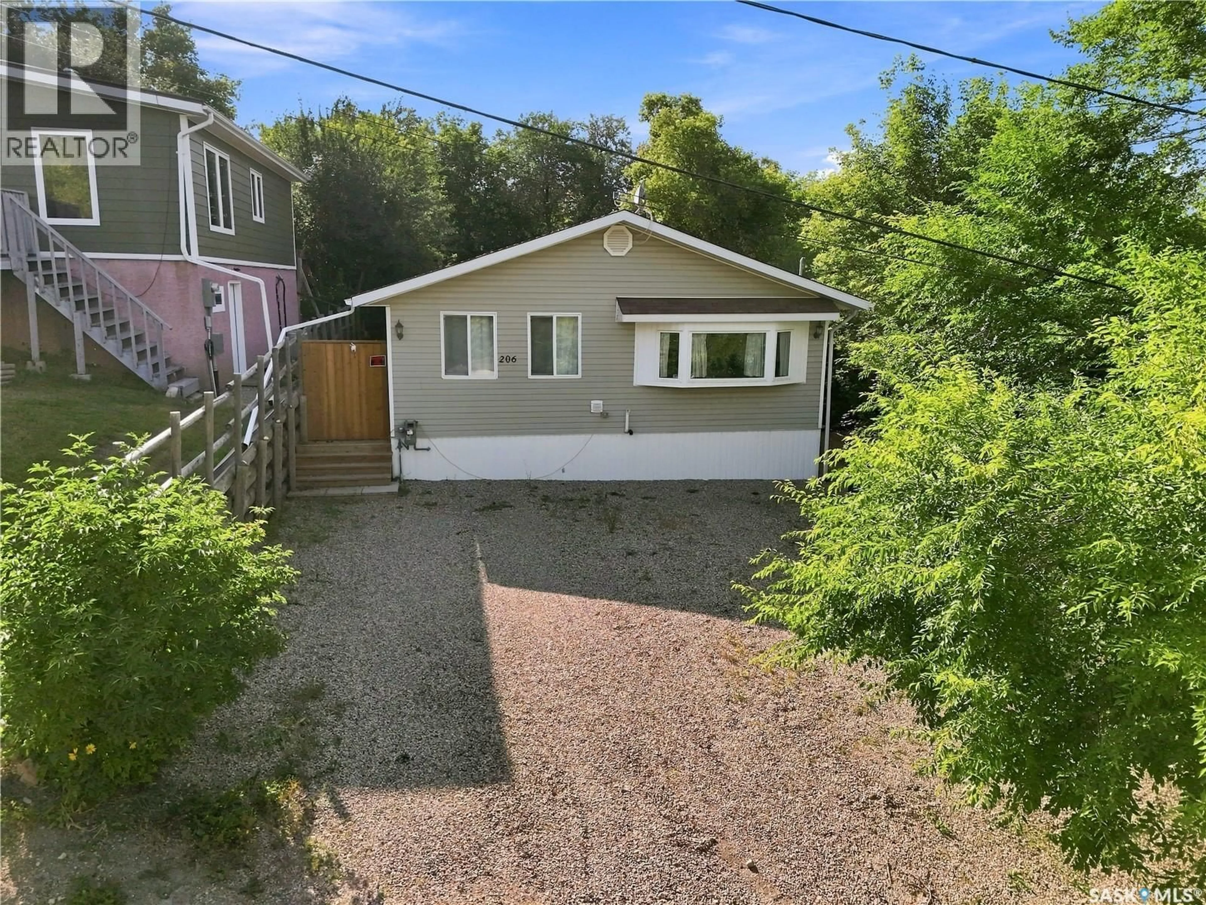 A pic from outside/outdoor area/front of a property/back of a property/a pic from drone, street for 206 ALBERT STREET, Manitou Beach Saskatchewan S0K4T1