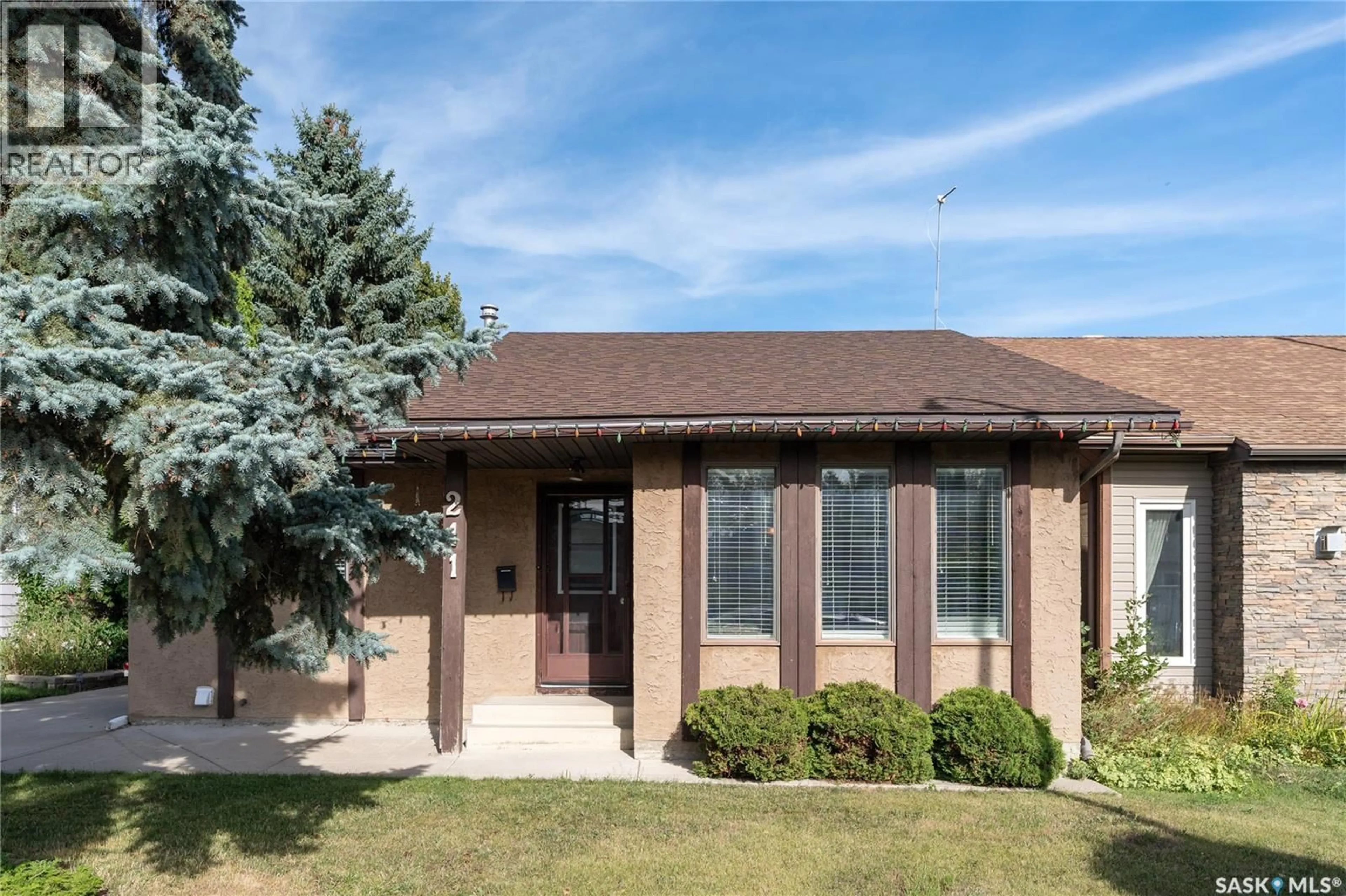 Home with brick exterior material, street for 211 DELARONDE LANE, Saskatoon Saskatchewan S7J3Z1