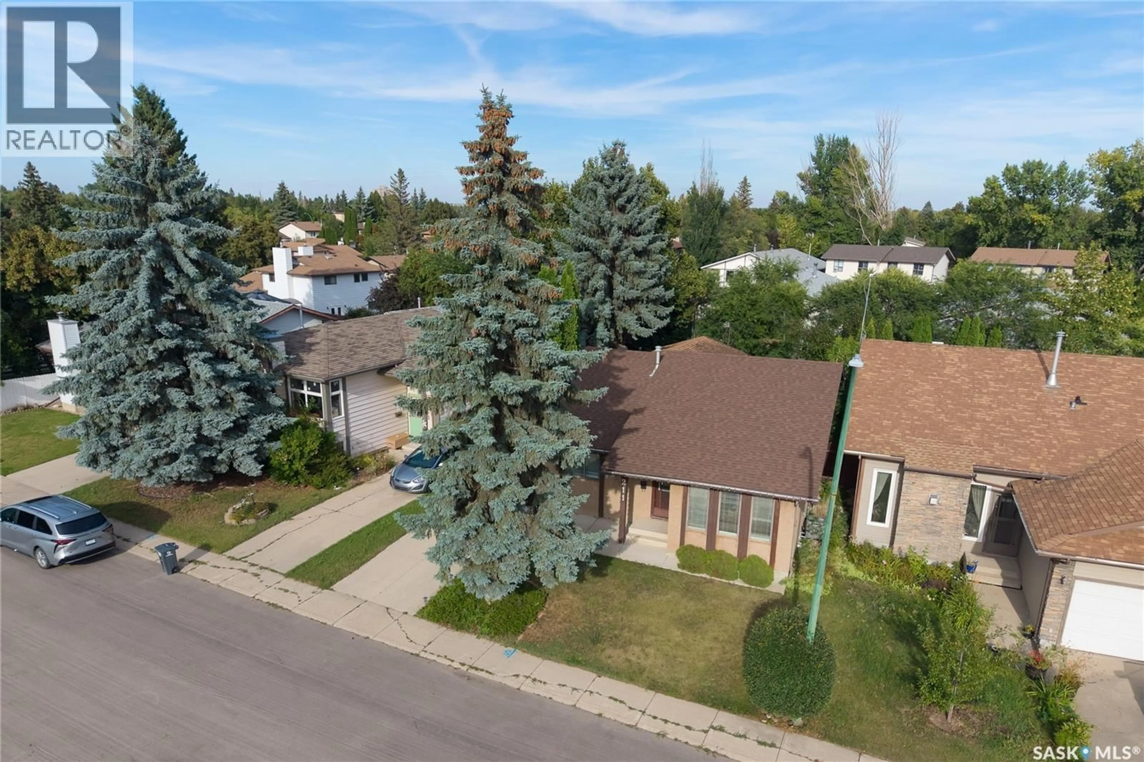 A pic from outside/outdoor area/front of a property/back of a property/a pic from drone, street for 211 DELARONDE LANE, Saskatoon Saskatchewan S7J3Z1