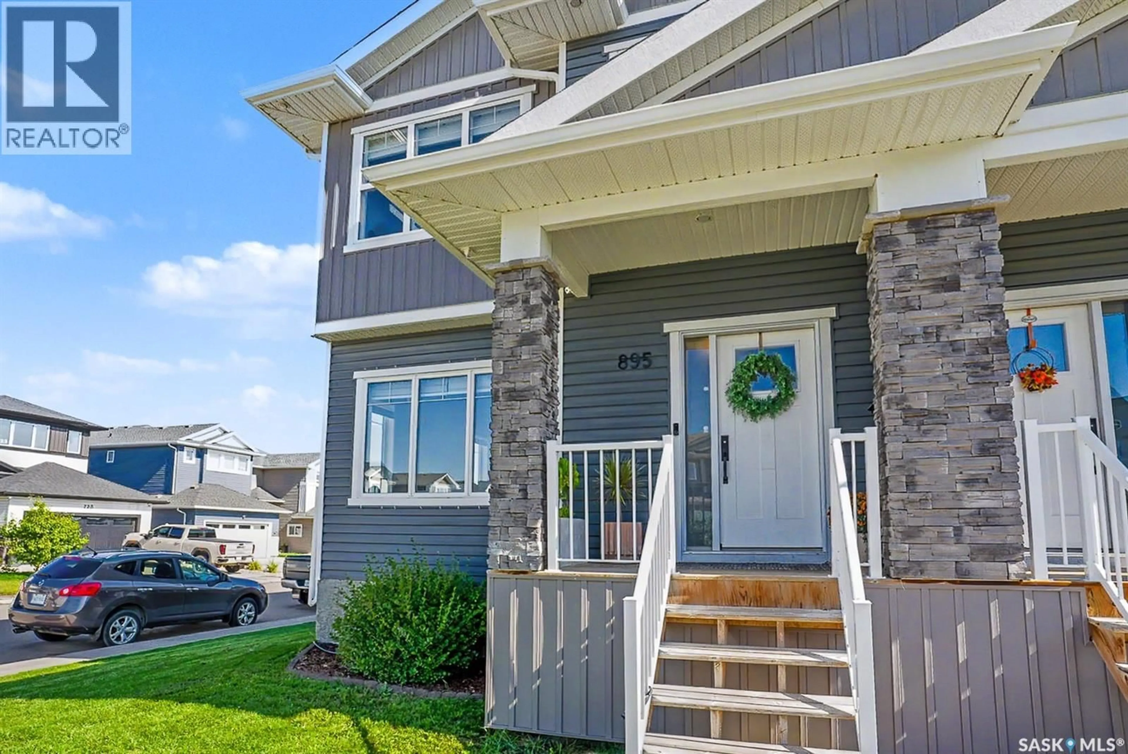 Home with vinyl exterior material, street for 895 MCFAULL RISE, Saskatoon Saskatchewan S7V0S9