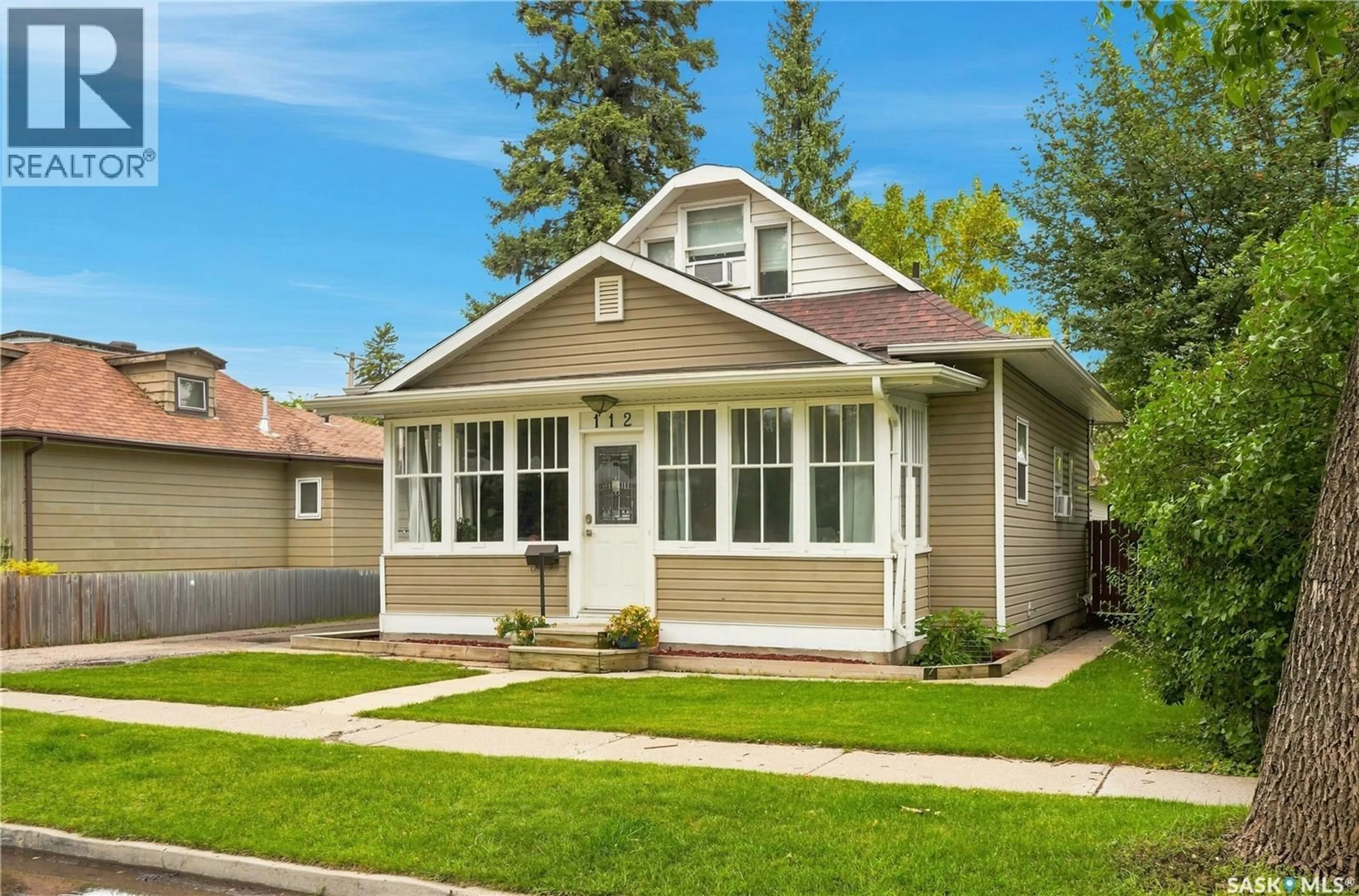 Home with vinyl exterior material, street for 112 112TH STREET, Saskatoon Saskatchewan S7N1T7