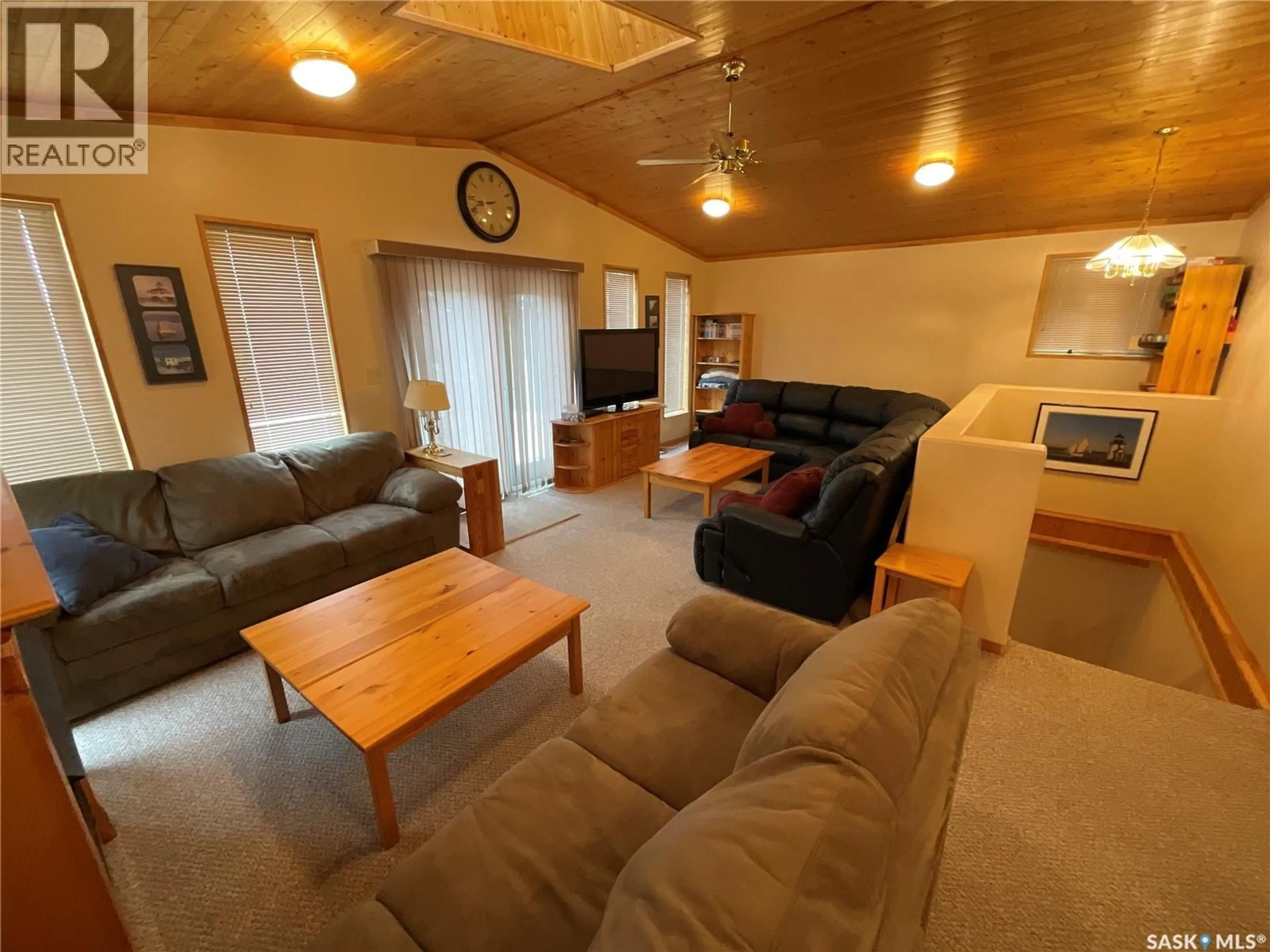 Living room with furniture, wood/laminate floor for 75 CRESCENT AVENUE, Wakaw Lake Saskatchewan S0K4P0
