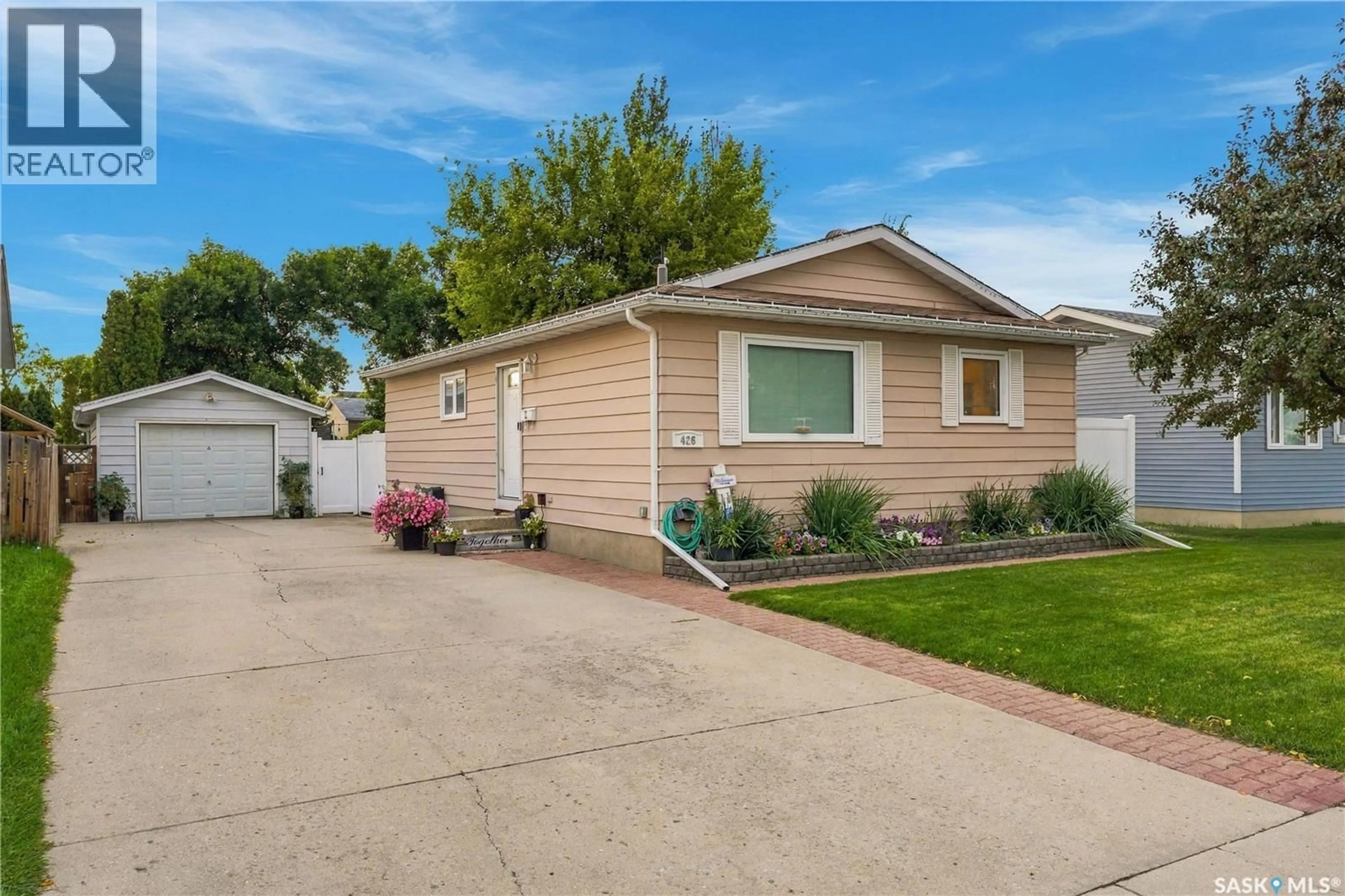 Home with vinyl exterior material, street for 426 LANGEVIN CRESCENT, Saskatoon Saskatchewan S7L5R6