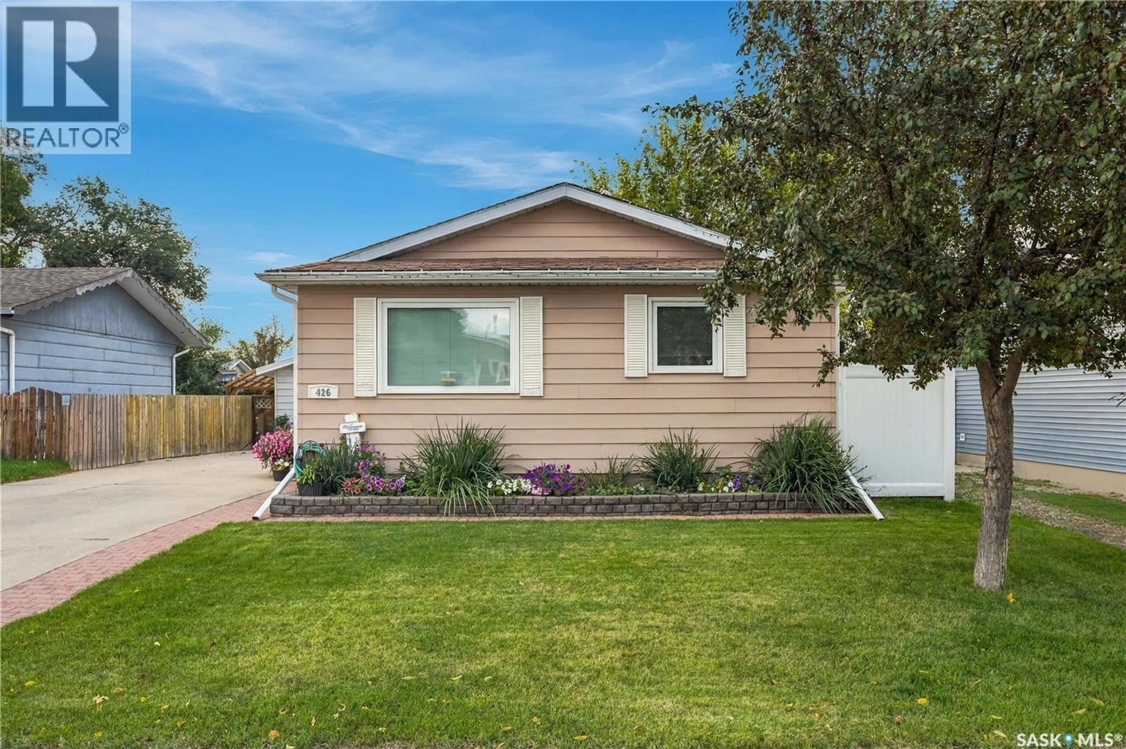 Home with vinyl exterior material, street for 426 LANGEVIN CRESCENT, Saskatoon Saskatchewan S7L5R6