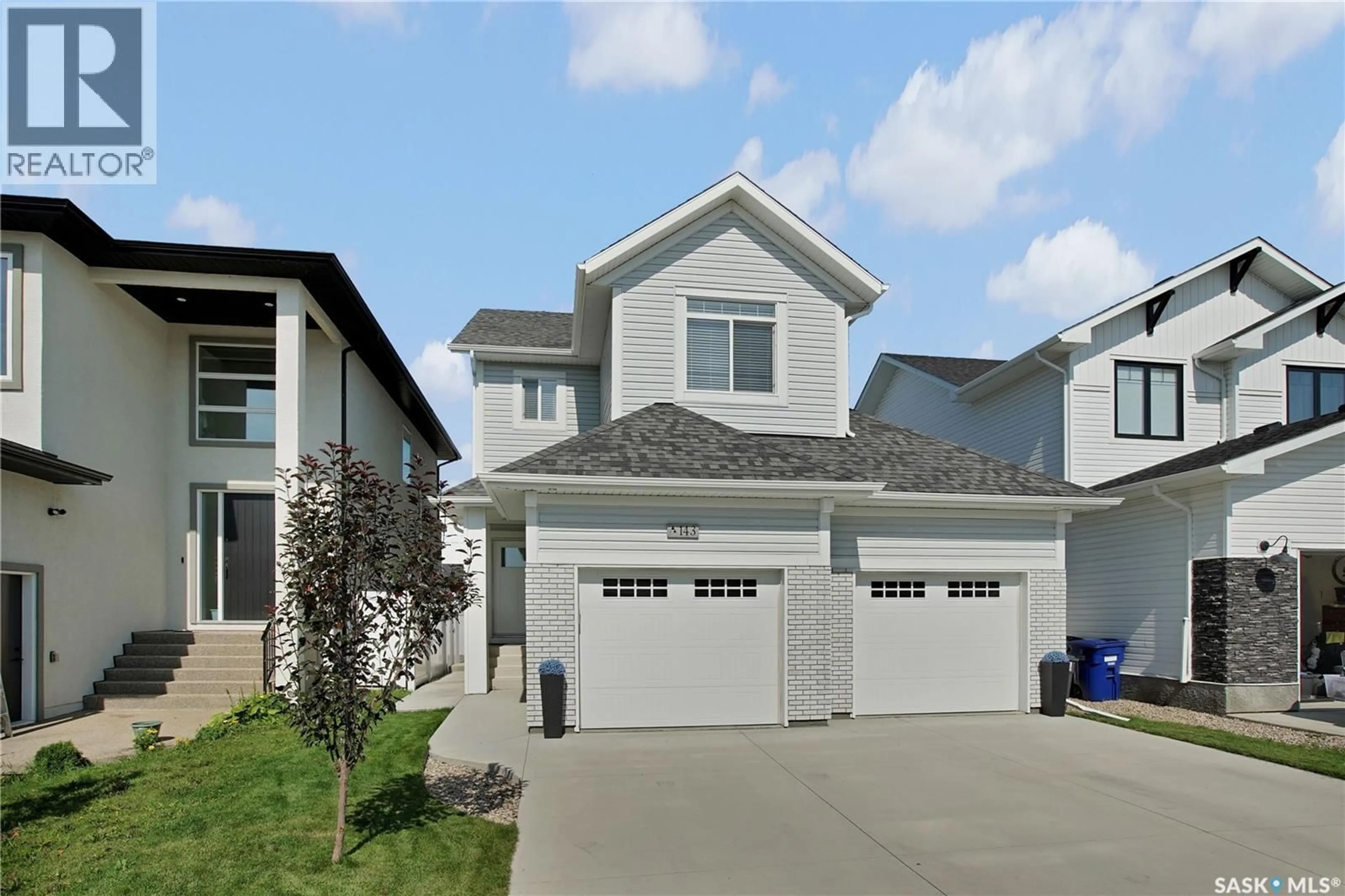 Home with vinyl exterior material, street for 143 BARRETT STREET, Saskatoon Saskatchewan S7W0Z8