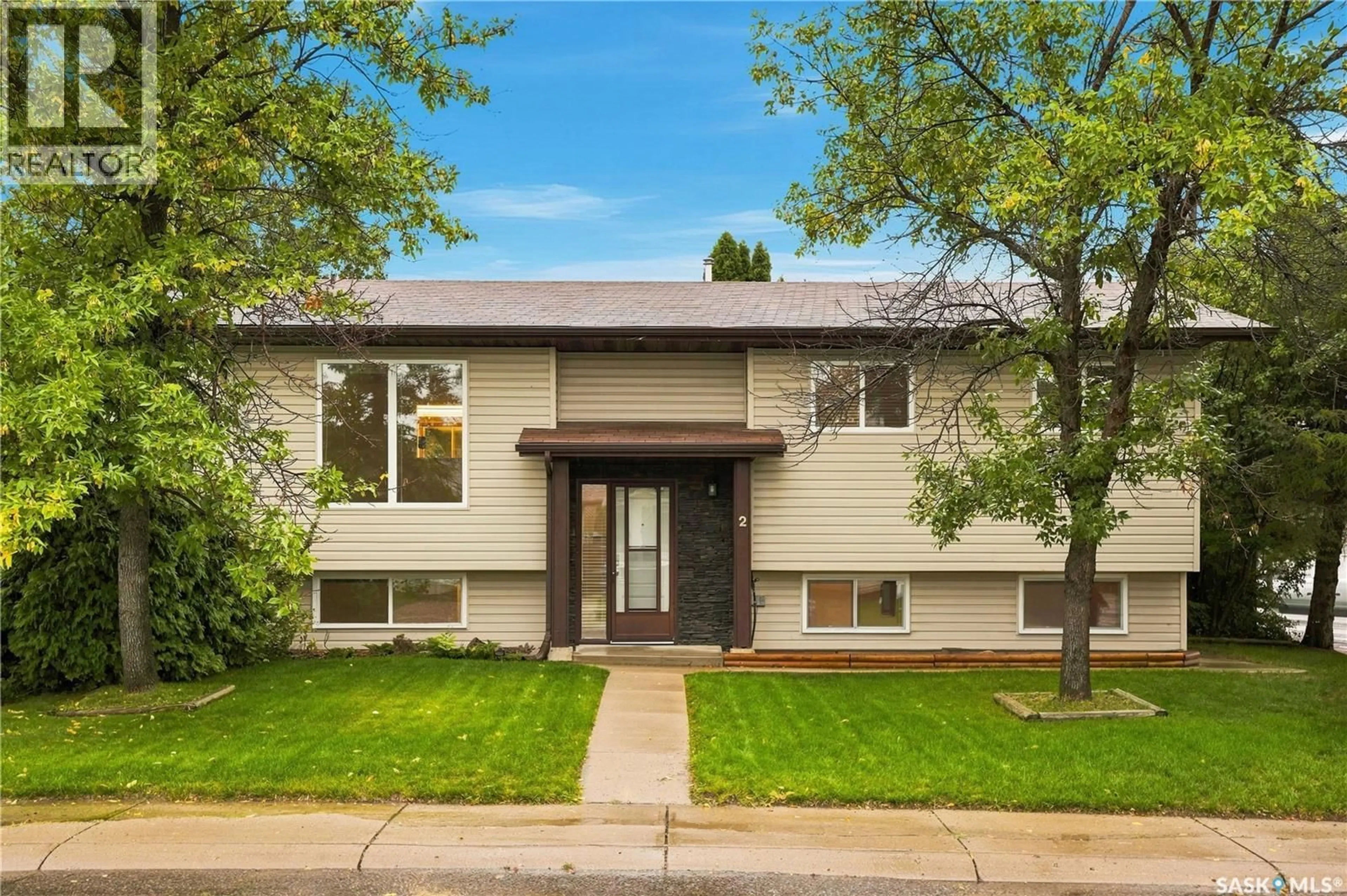 Home with vinyl exterior material, street for 2 CARROTHERS COURT, Saskatoon Saskatchewan S7L6T3