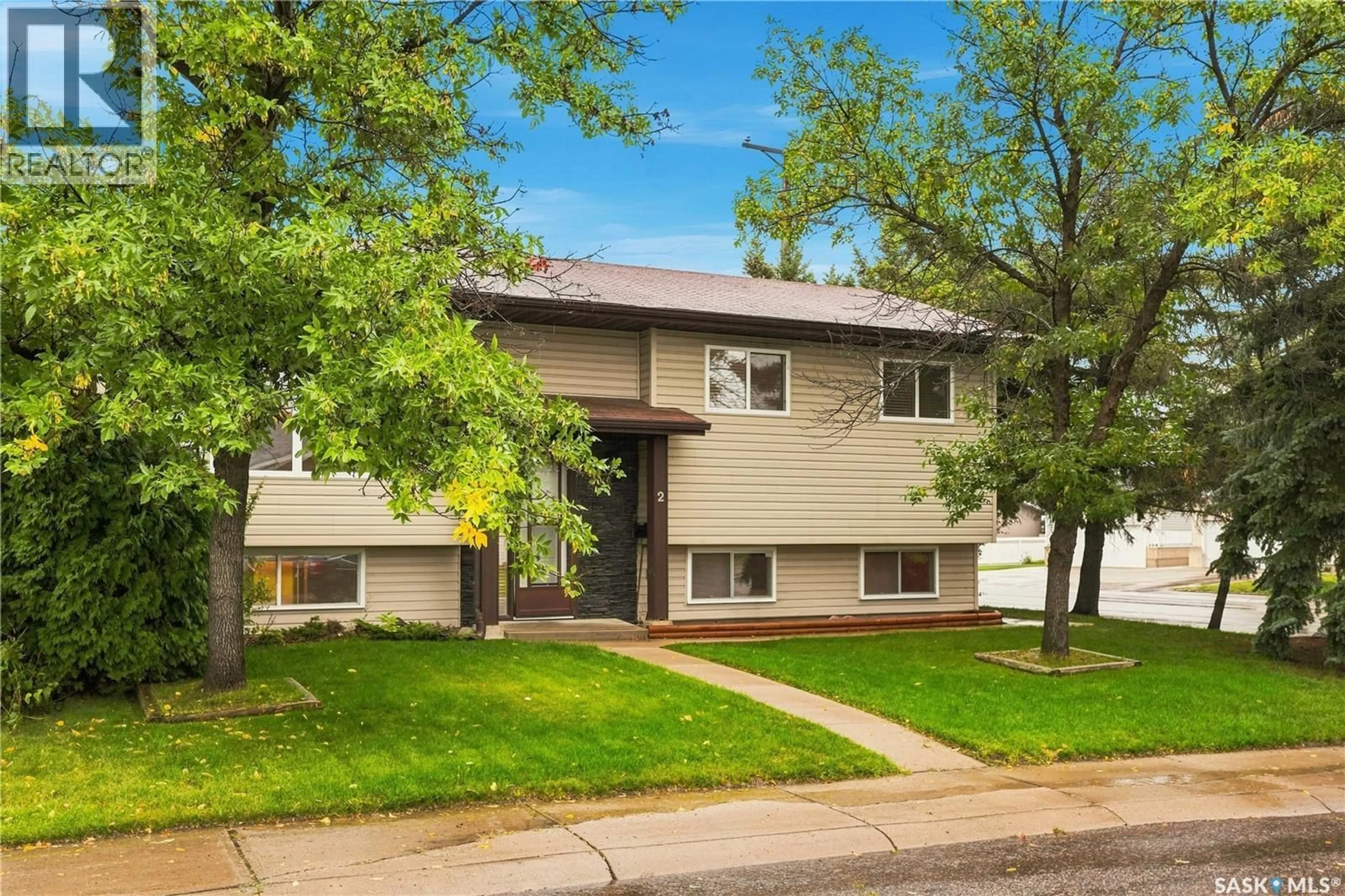 Home with vinyl exterior material, street for 2 CARROTHERS COURT, Saskatoon Saskatchewan S7L6T3