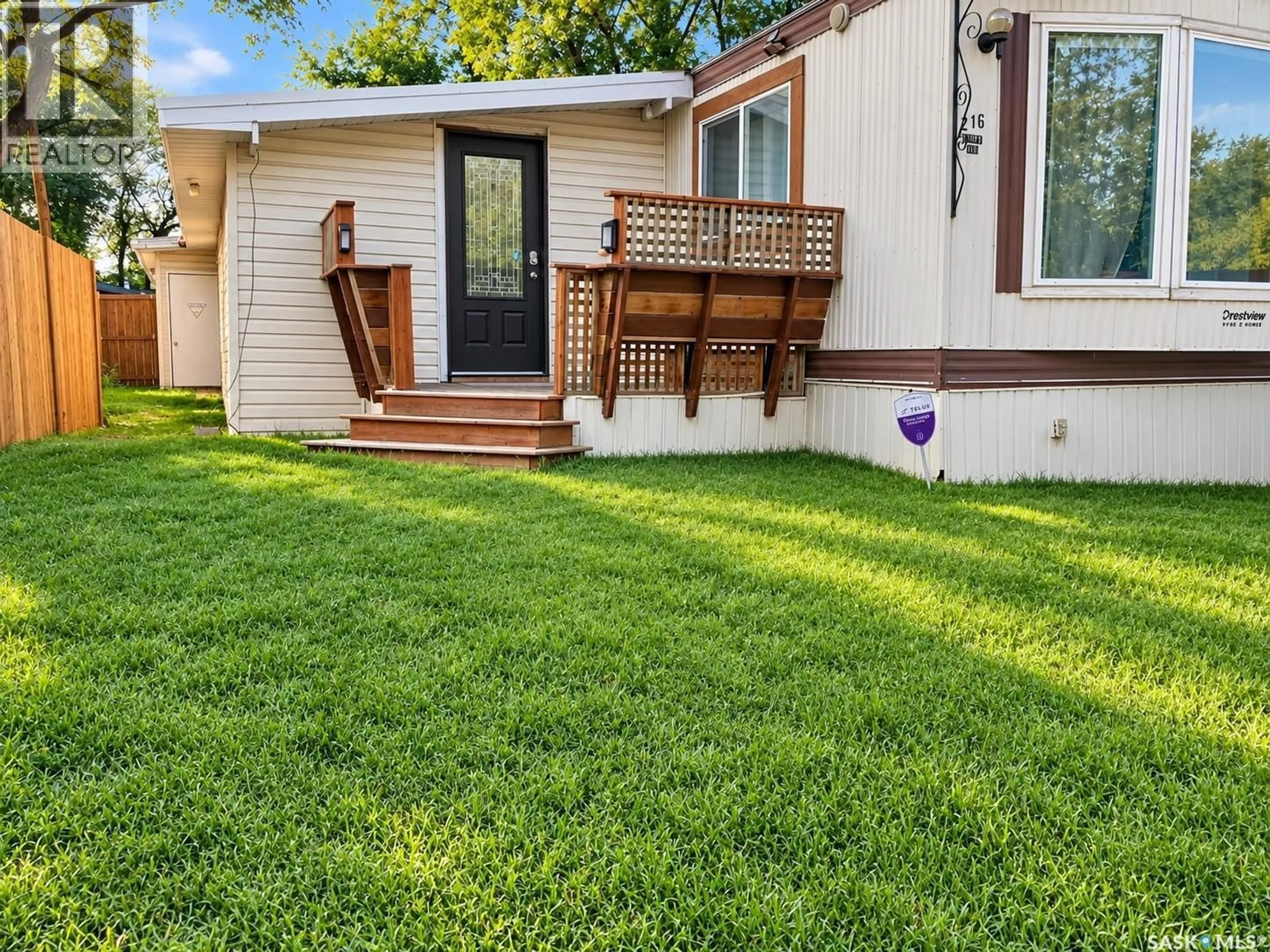 Home with vinyl exterior material, street for 216 - 1524 RAYNER AVENUE, Saskatoon Saskatchewan S7N1Y1