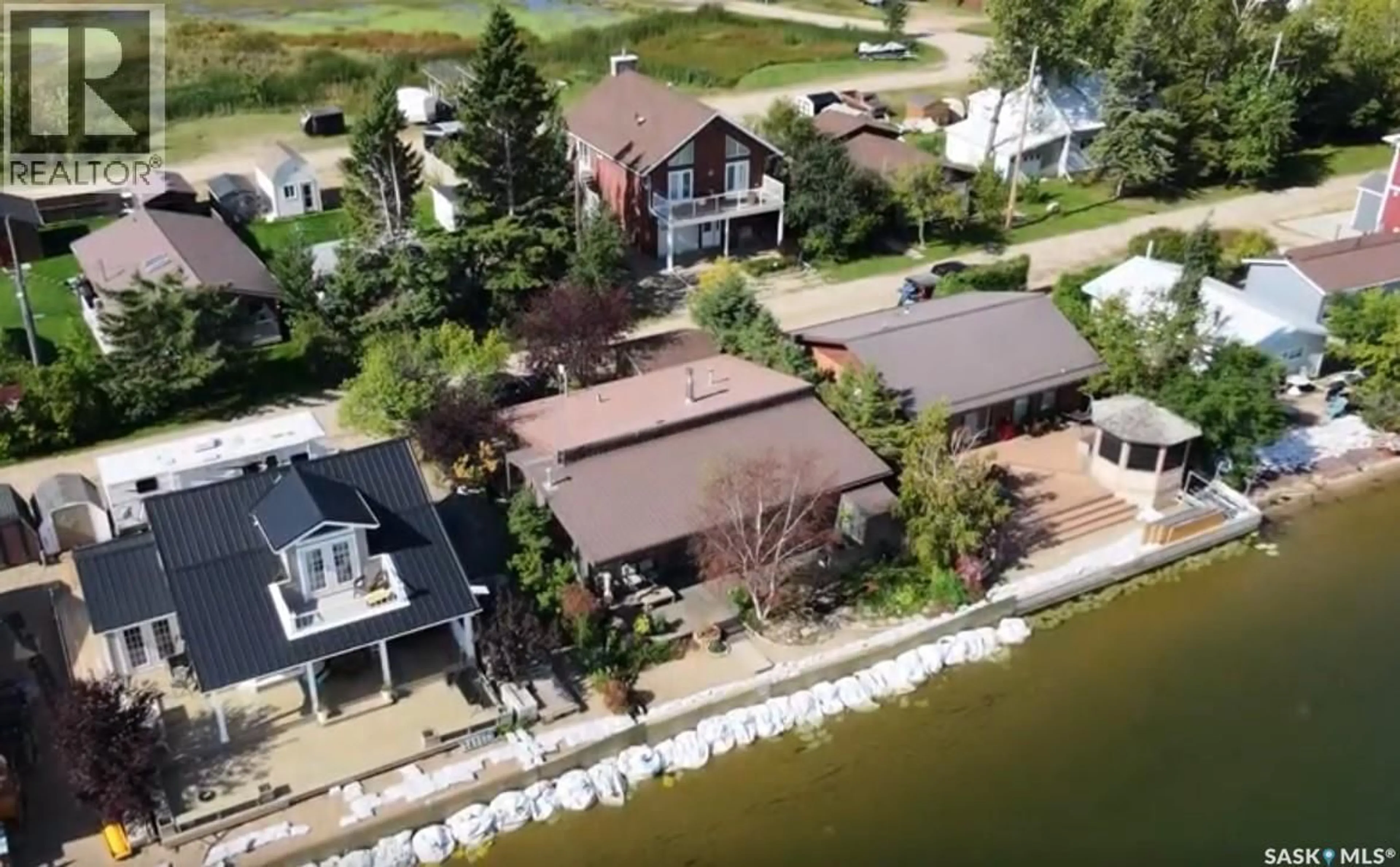 A pic from outside/outdoor area/front of a property/back of a property/a pic from drone, water/lake/river/ocean view for 122 LAKESHORE LANE, Leslie Beach Saskatchewan S0A1A0