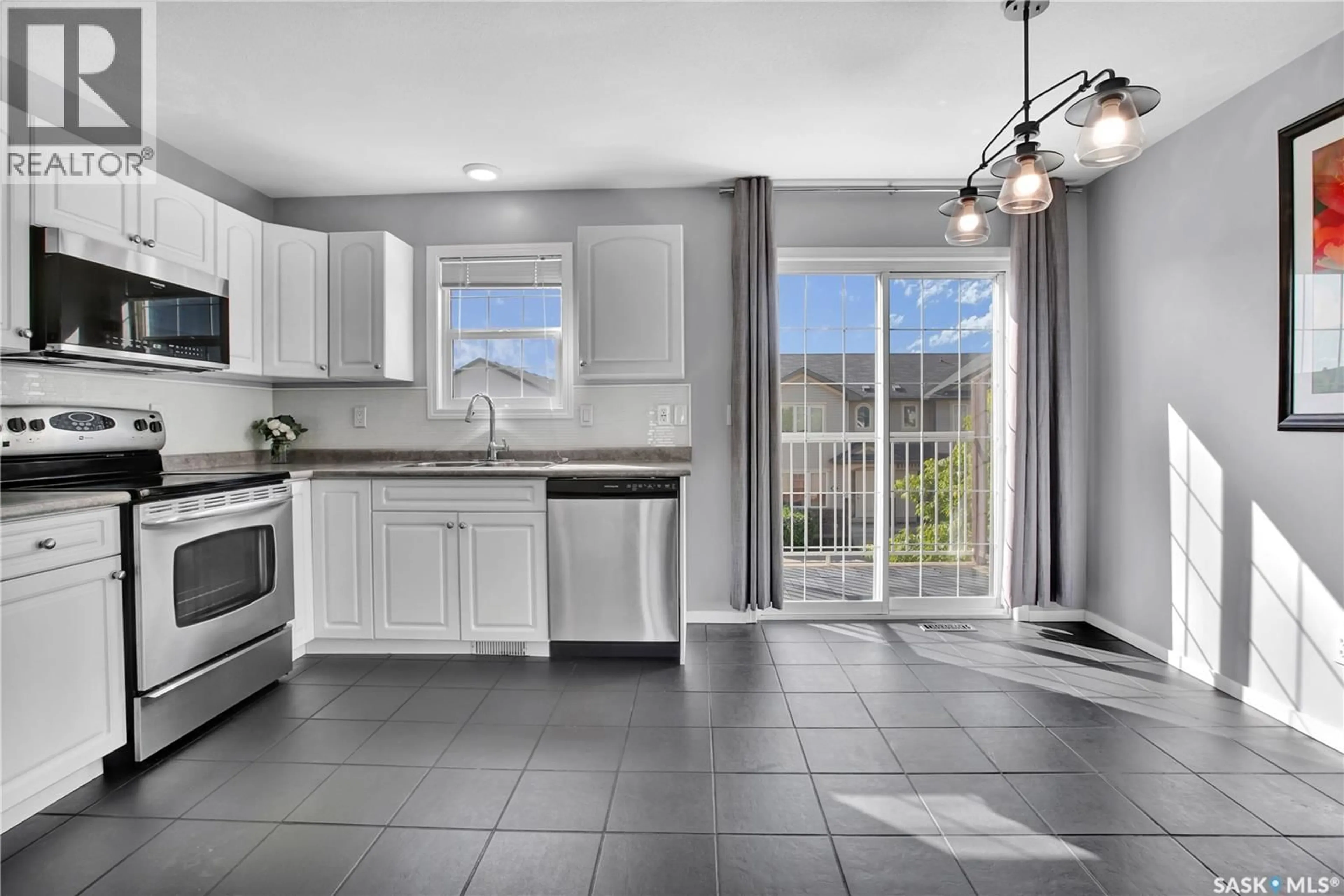 Open concept kitchen, ceramic/tile floor for 135 - 58 PAWLYCHENKO LANE, Saskatoon Saskatchewan S7V1K2
