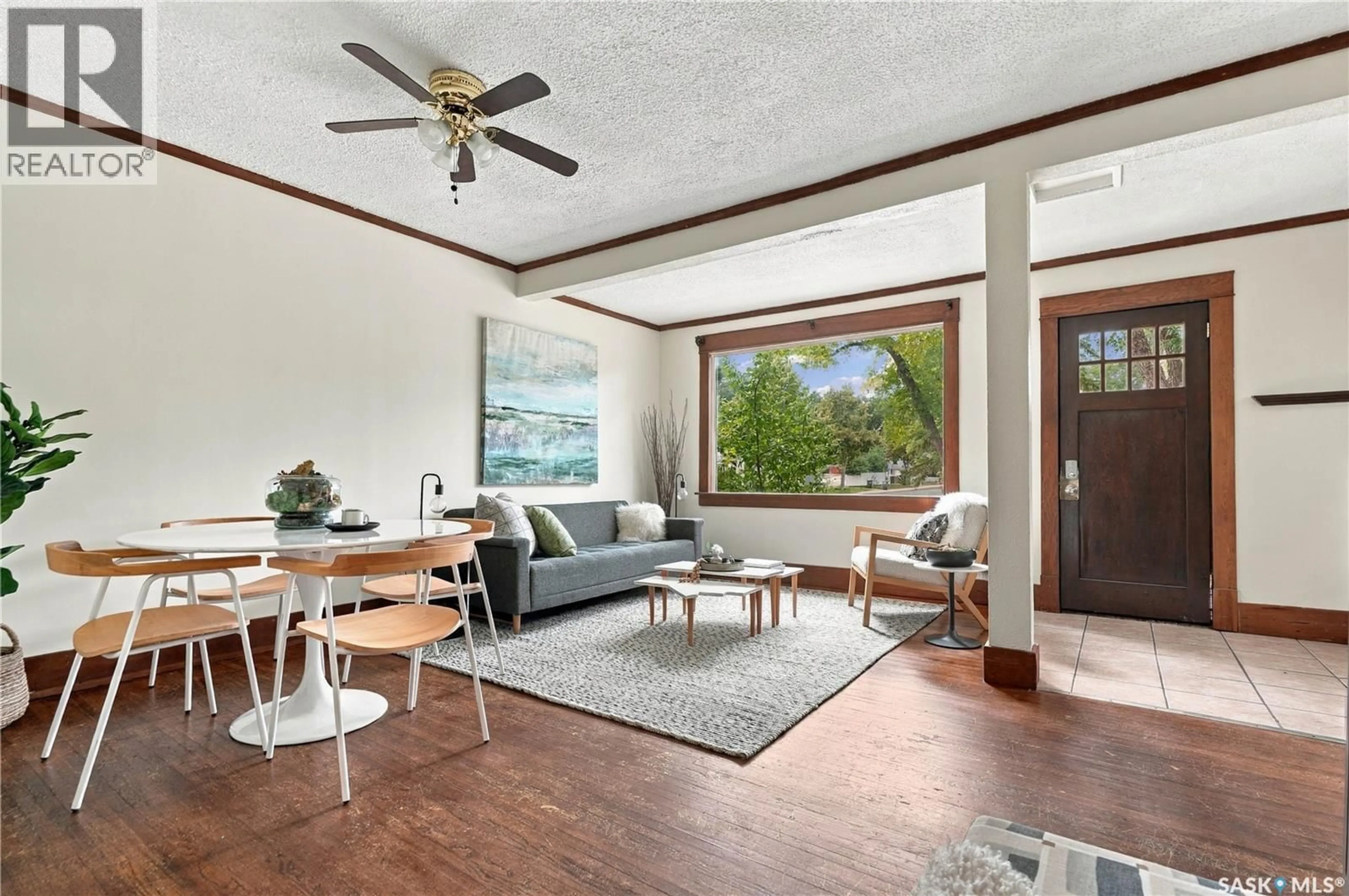 Living room with furniture, wood/laminate floor for 1150 K AVENUE, Saskatoon Saskatchewan S7M2G5