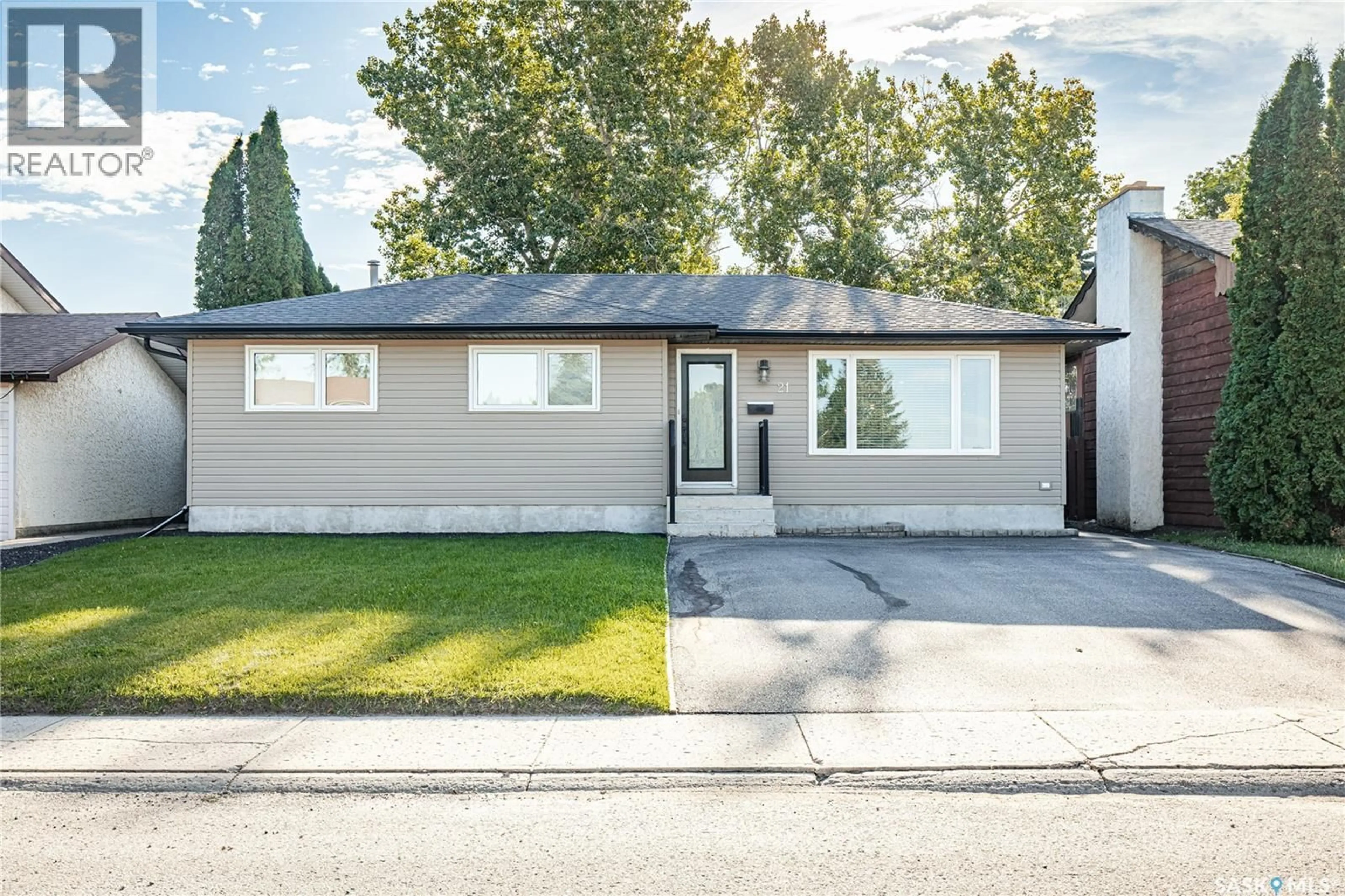 Home with vinyl exterior material, street for 21 BLUE SAGE DRIVE, Moose Jaw Saskatchewan S6J1A5