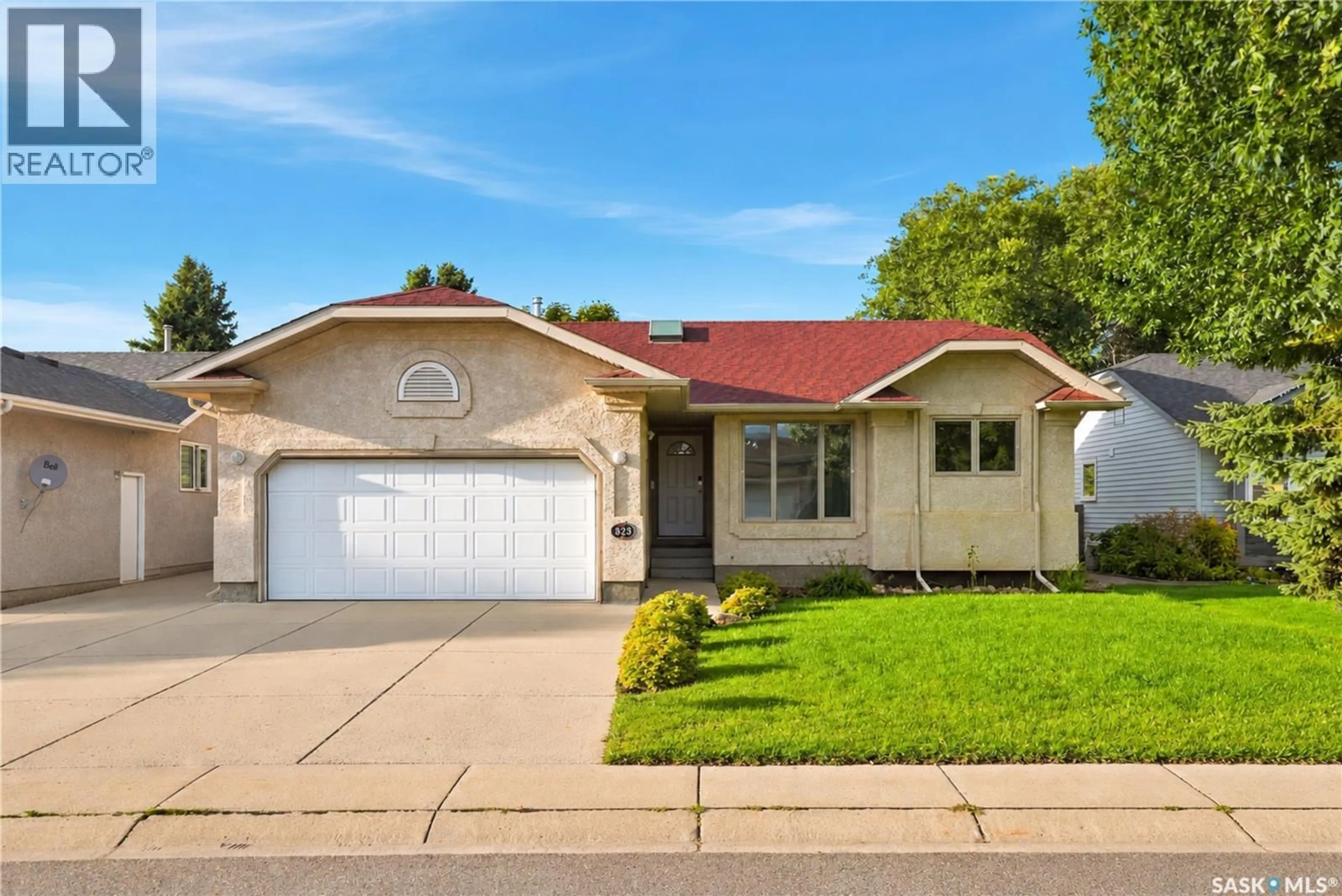 Home with vinyl exterior material, street for 323 GARVIE ROAD, Saskatoon Saskatchewan S7S1A3