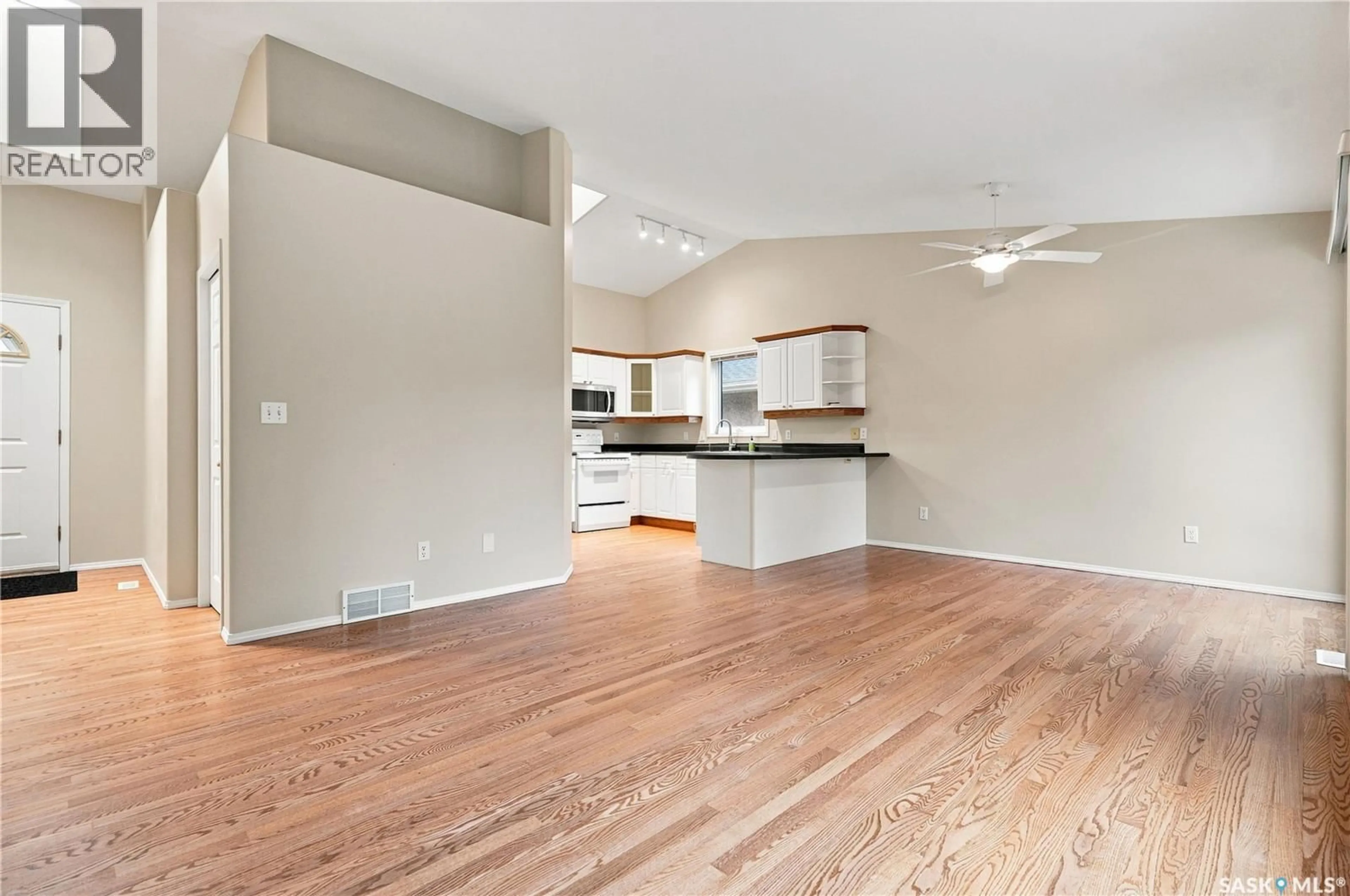 Open concept kitchen, wood/laminate floor for 323 GARVIE ROAD, Saskatoon Saskatchewan S7S1A3